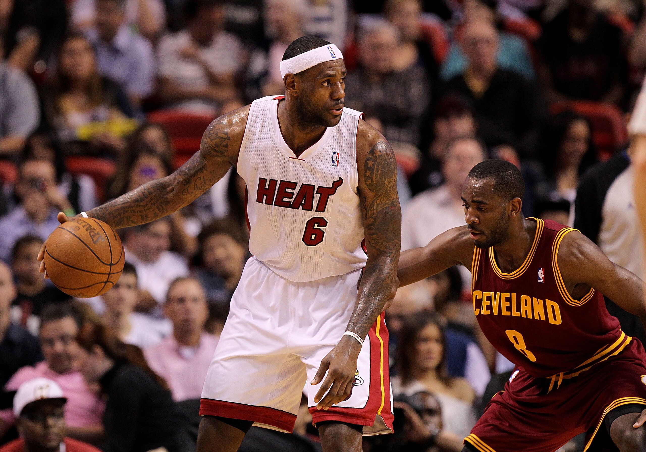 MIAMI, FL - JANUARY 31: LeBron James #6 of the Miami Heat posts up Christian Eyenga #8 of the Cleveland Cavaliers during a game at American Airlines Arena on January 31, 2011 in Miami, Florida. NOTE TO USER: User expressly acknowledges and agrees that, by