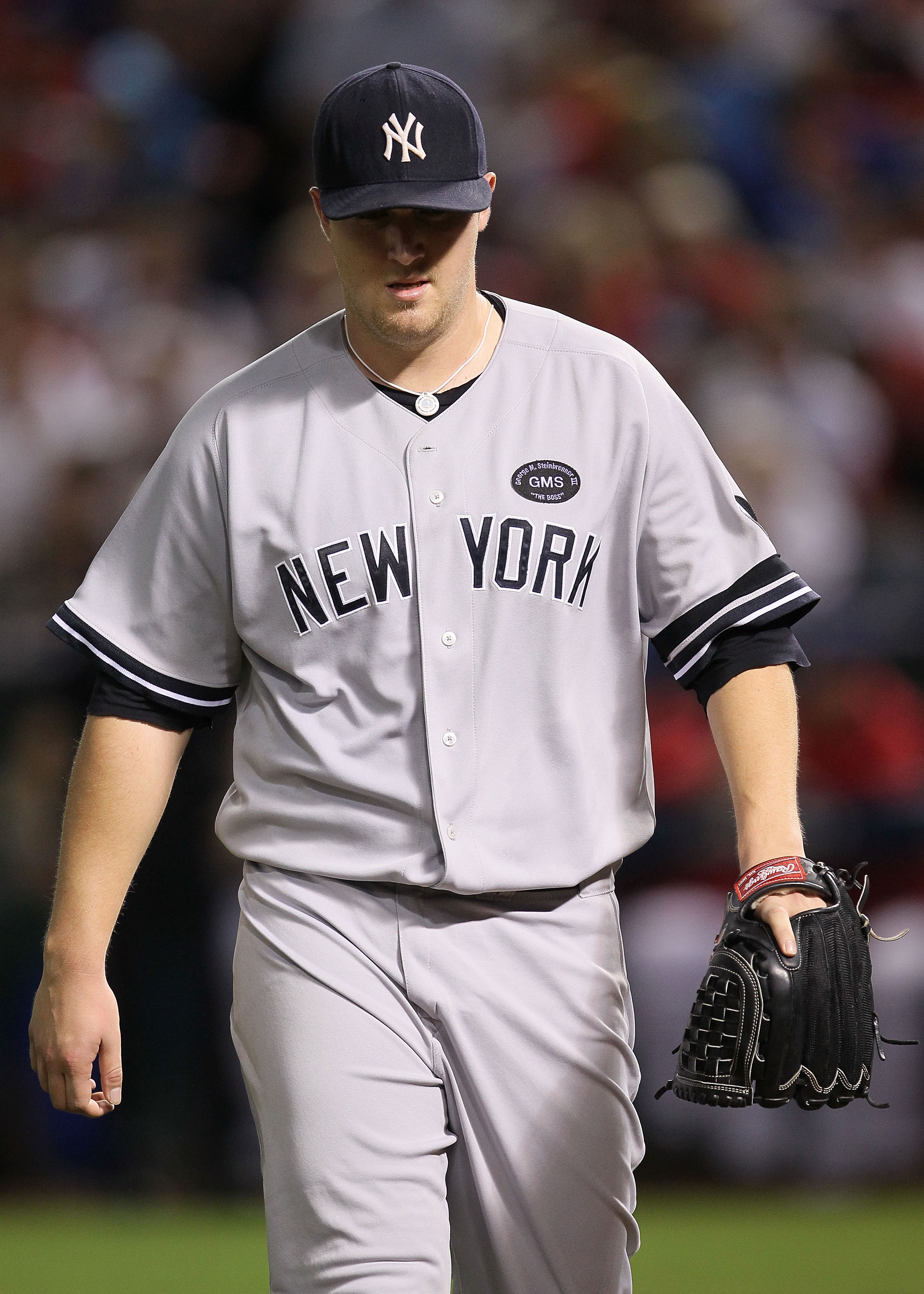 ARLINGTON, TX - OCTOBER 22:  Phil Hughes #65 of the New York Yankees walks on the field during Game Six of the ALCS against the Texas Rangers in the 2010 MLB Playoffs at Rangers Ballpark in Arlington on October 22, 2010 in Arlington, Texas.  (Photo by Ste