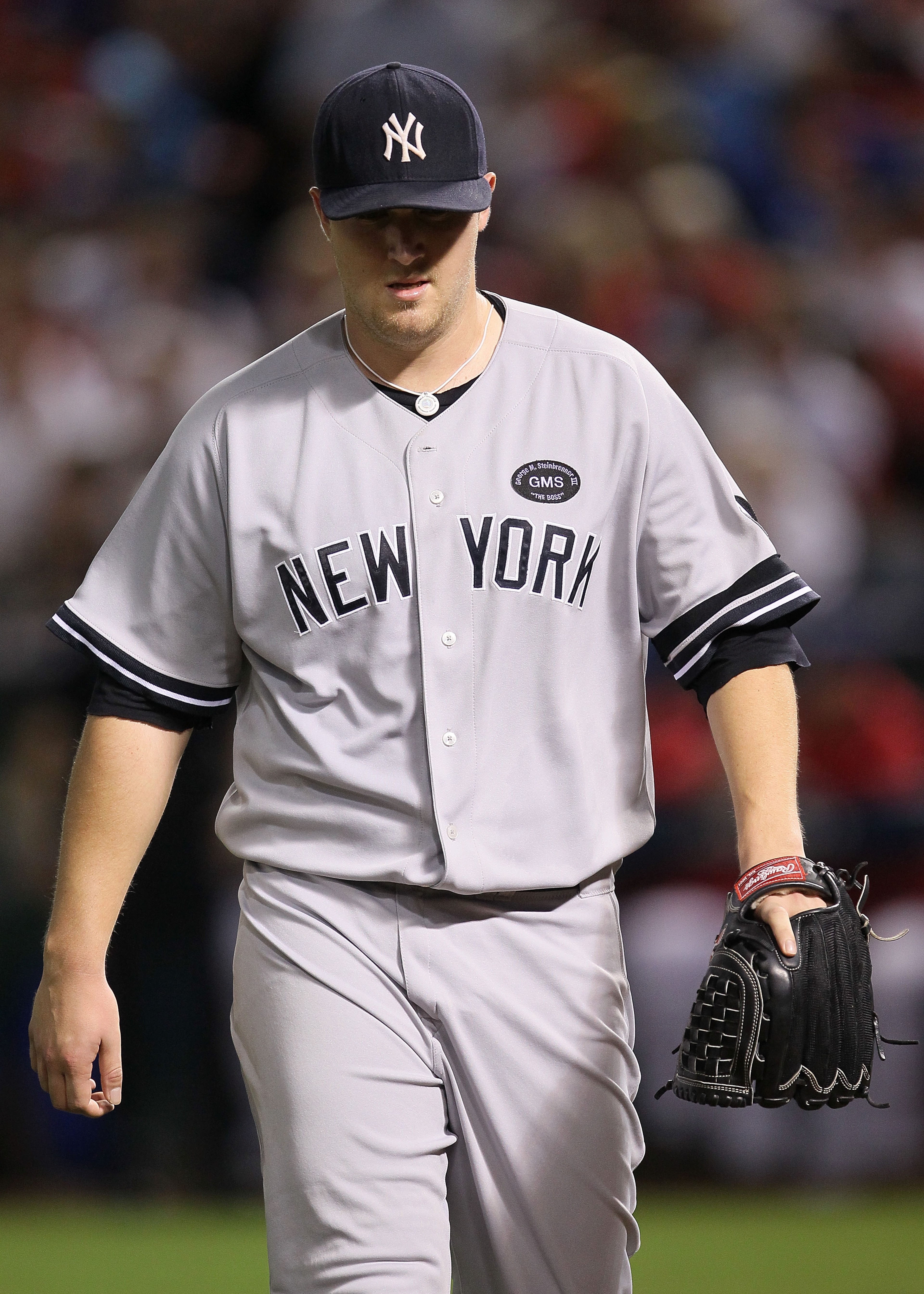 ARLINGTON, TX - OCTOBER 22:  Phil Hughes #65 of the New York Yankees walks on the field during Game Six of the ALCS against the Texas Rangers in the 2010 MLB Playoffs at Rangers Ballpark in Arlington on October 22, 2010 in Arlington, Texas.  (Photo by Ste