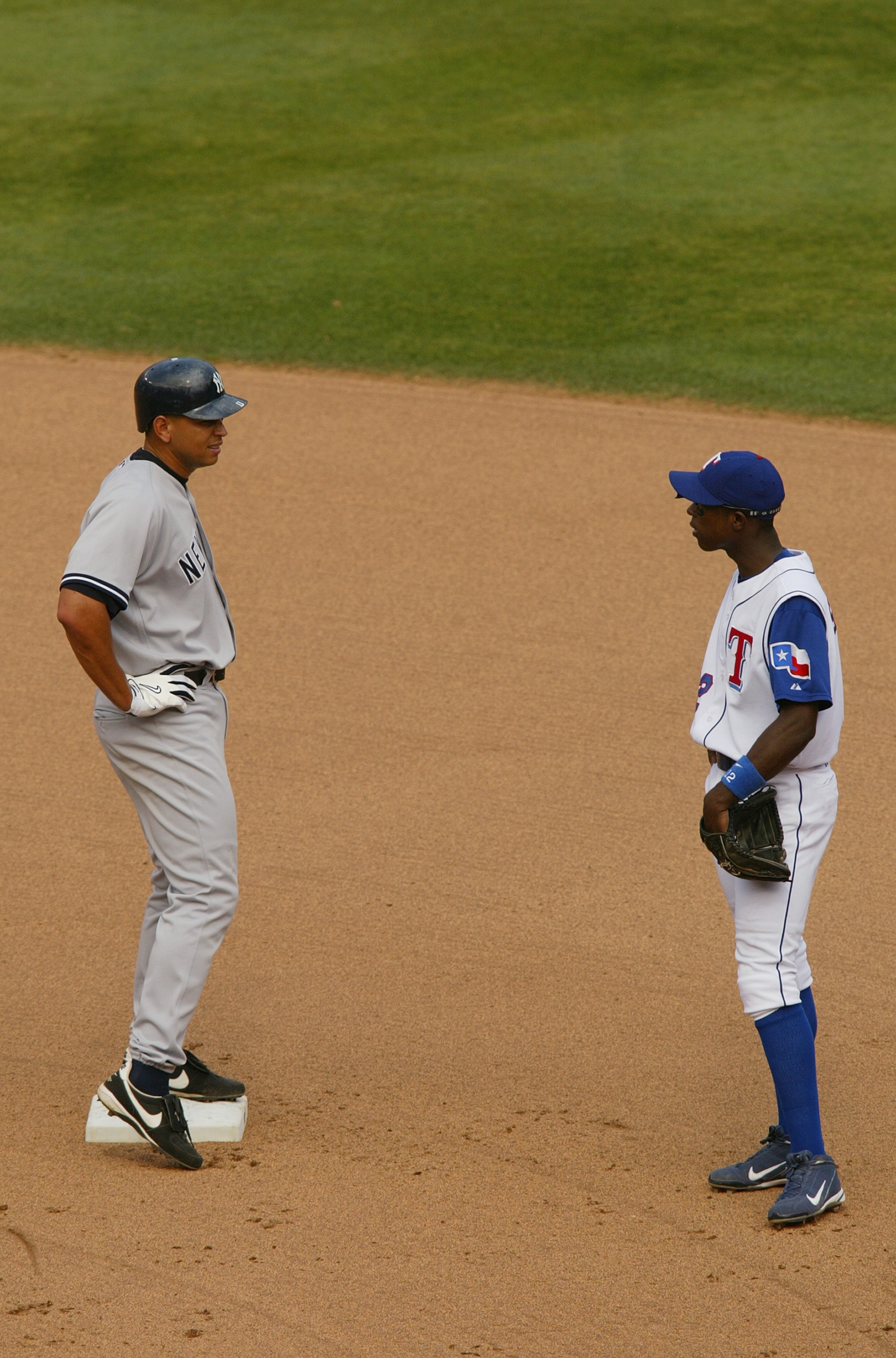 ARLINGTON, TX - MAY 22: Infielder Alfonso Soriano #12 of the Texas Rangers talks to infielder Alex Rodriguez #13 of the New York Yankees during the game at Ameriquest Field in Arlington on May 22, 2004 in Arlington, Texas. The Rangers won 4-3. (Photo b ARLINGTON, TX - MAY 22: Infielder Alfonso Soriano #12 of the Texas Rangers talks to infielder Alex Rodriguez #13 of the New York Yankees during the game at Ameriquest Field in Arlington on May 22, 2004 in Arlington, Texas. The Rangers won 4-3. (Photo b