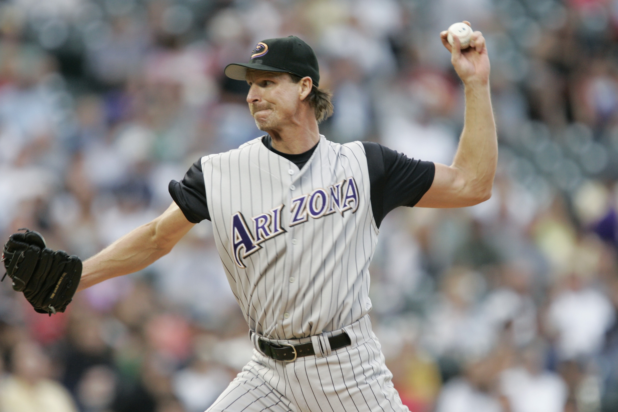 DENVER - JULY 30: Randy Johnson #51 of the Arizona Diamondbacks throws against the Colorado Rockies on July 30, 2004 at Coors Field in Denver, Colorado. The Rockies defeated the Diamondbacks 4-1. (Photo by Brian Bahr/Getty Images) DENVER - JULY 30: Randy Johnson #51 of the Arizona Diamondbacks throws against the Colorado Rockies on July 30, 2004 at Coors Field in Denver, Colorado. The Rockies defeated the Diamondbacks 4-1. (Photo by Brian Bahr/Getty Images)