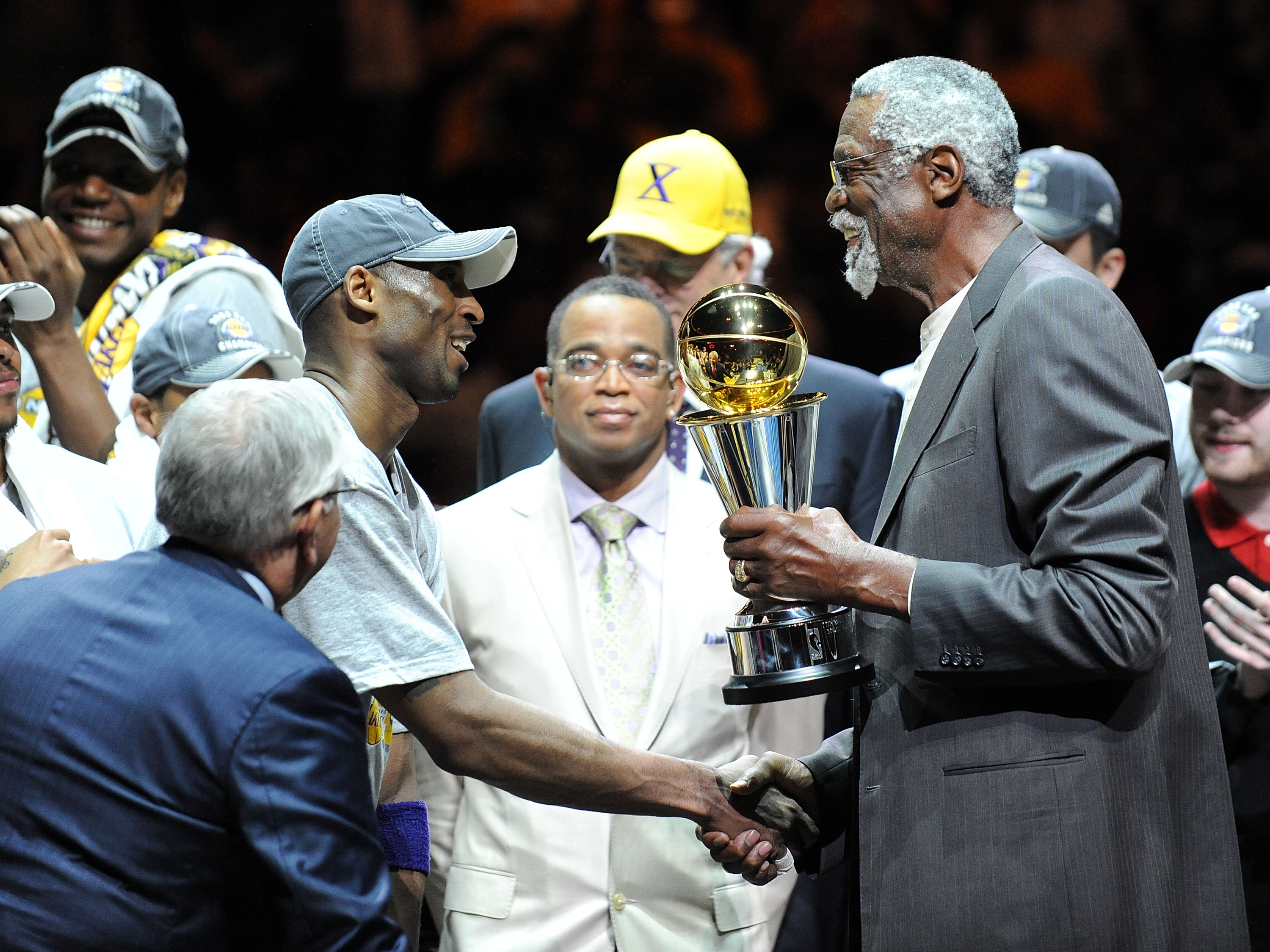 ORLANDO, FL - JUNE 14:  Kobe Bryant #24 of the Los Angeles Lakers receives the Bill Russell MVP trophy from Bill Russell after the Lakers defeated the Orlando Magic 99-86 in Game Five of the 2009 NBA Finals on June 14, 2009 at Amway Arena in Orlando, Flor