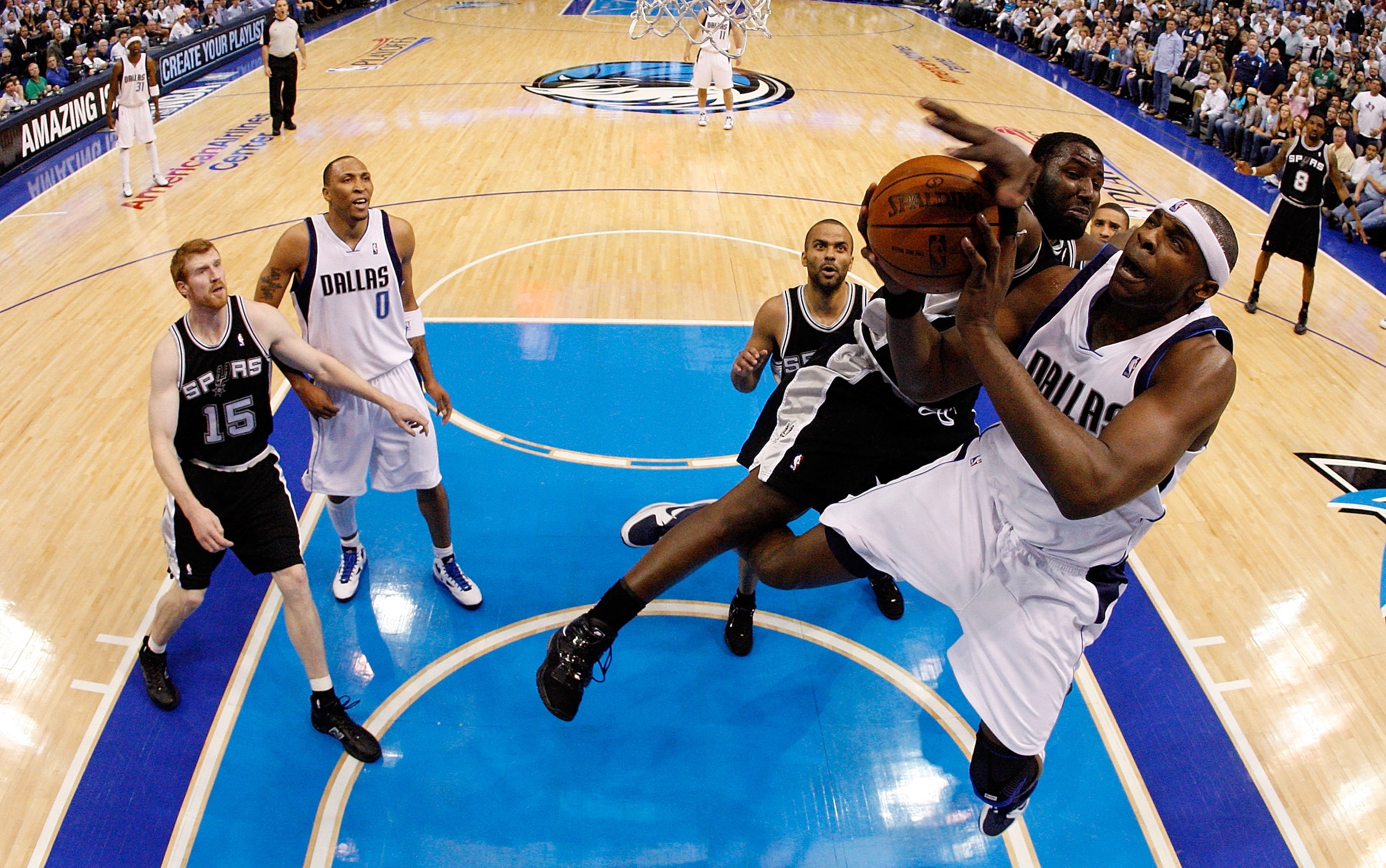 DALLAS - APRIL 27:  Center Brendan Haywood #33 of the Dallas Mavericks takes a shot against DeJuan Blair #45 of the San Antonio Spurs in Game Five of the Western Conference Quarterfinals during the 2010 NBA Playoffs at American Airlines Center on April 27