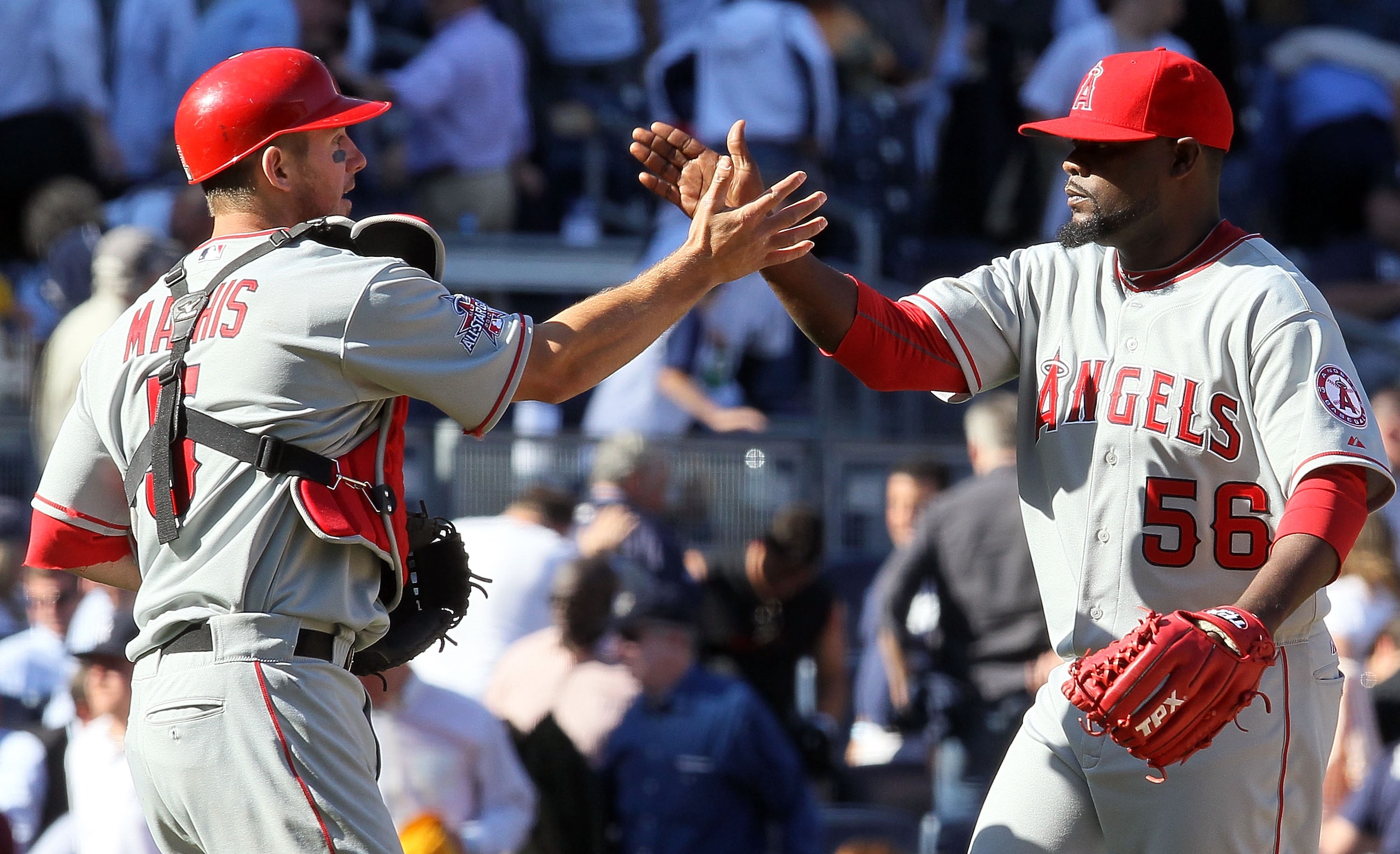 NEW YORK - APRIL 14:  Jeff Mathis #5 and Fernando Rodney #56 of the Los Angeles Angels of Anaheim celebrate after defeating the New York Yankees on April 14, 2010 at Yankee Stadium in the Bronx borough of New York City.  (Photo by Jim McIsaac/Getty Images
