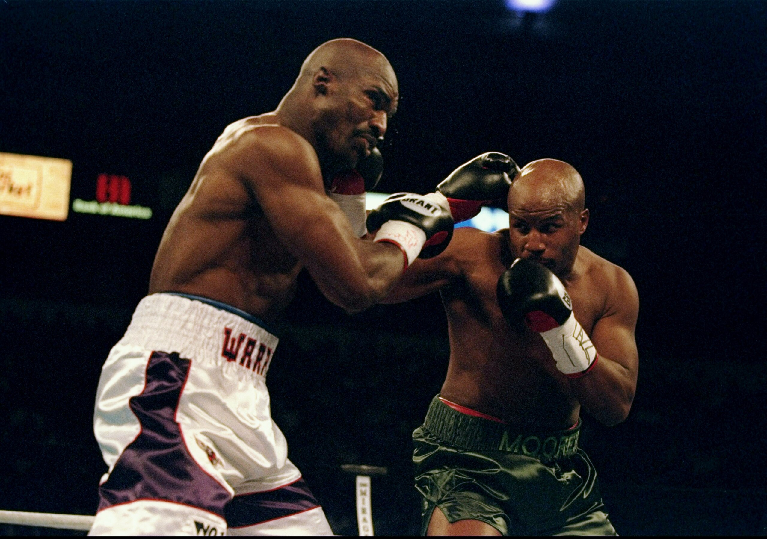 8 Nov 1997:  Michael Moorer and Evander Holyfield throw punches at each other during a fight at the Thomas and Mack Center in Las Vegas, Nevada.  Holyfield won the fight by a technical knockout. Mandatory Credit: Al Bello  /Allsport