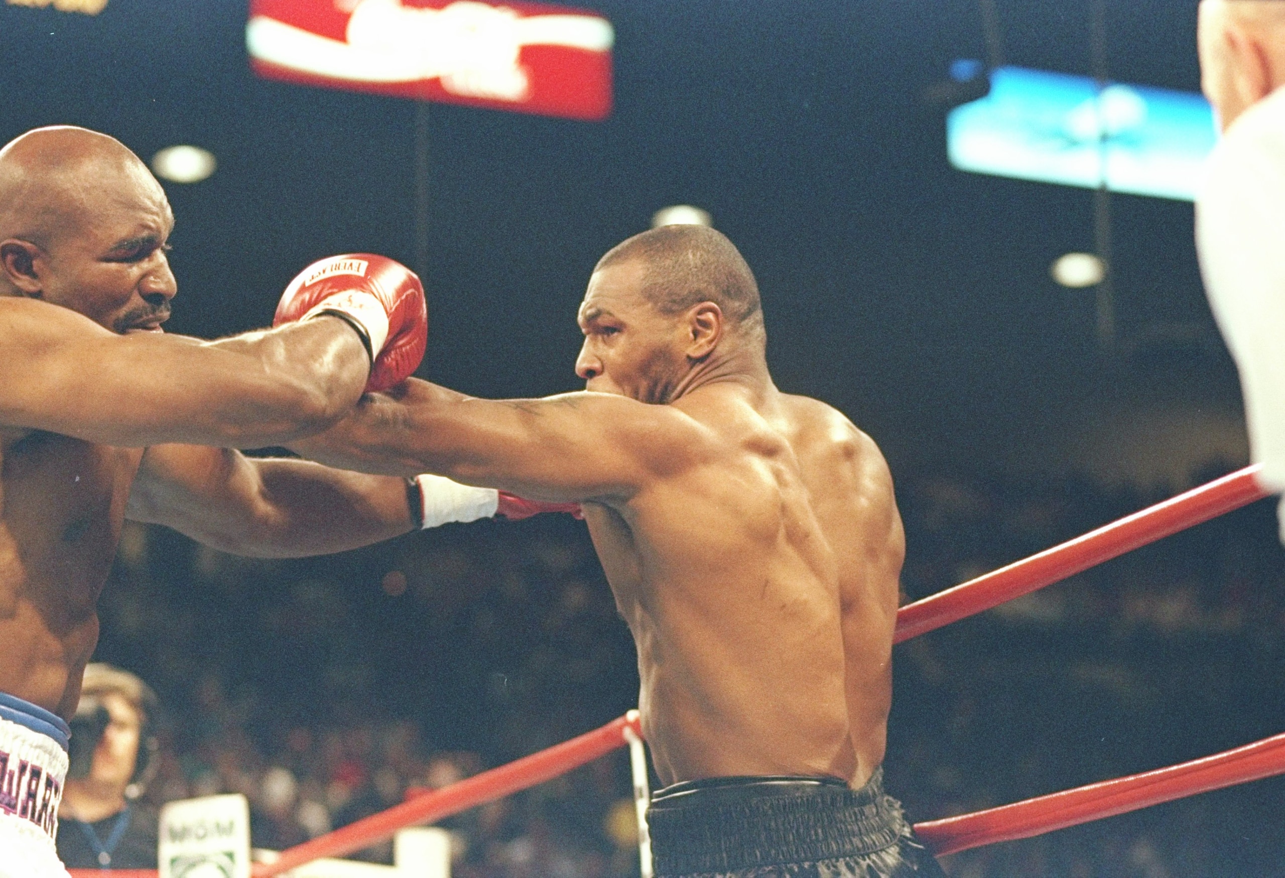 28 Jun 1997:  Mike Tyson (right) and Evander Holyfield square off during their bout at the MGM Grand Garden in Las Vegas, Nevada.  Holyfield won the fight when referee Mills Lane disqualified Tyson in the third round after biting Holyfield twice. Mandator