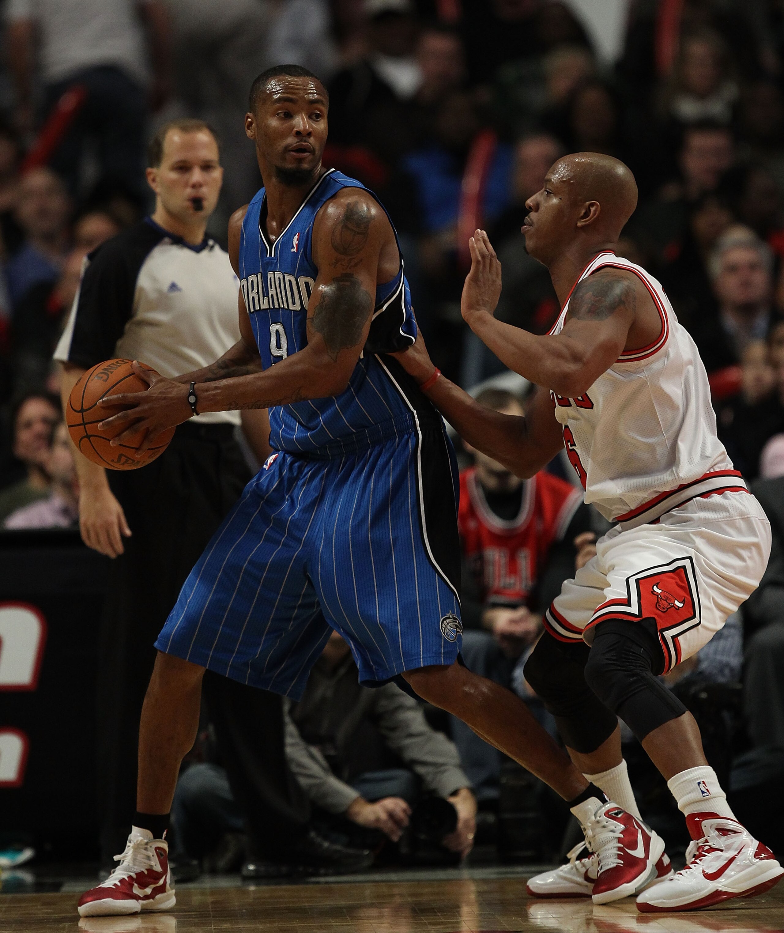 CHICAGO, IL - DECEMBER 01: Rashard Lewis #9 of the Orlando Magic looks to pass under pressure from Keith Bogans #6 of the Chicago Bulls at the United Center on December 1, 2010 in Chicago, Illinois. The Magic defeated the Bulls 107-78. NOTE TO USER: User