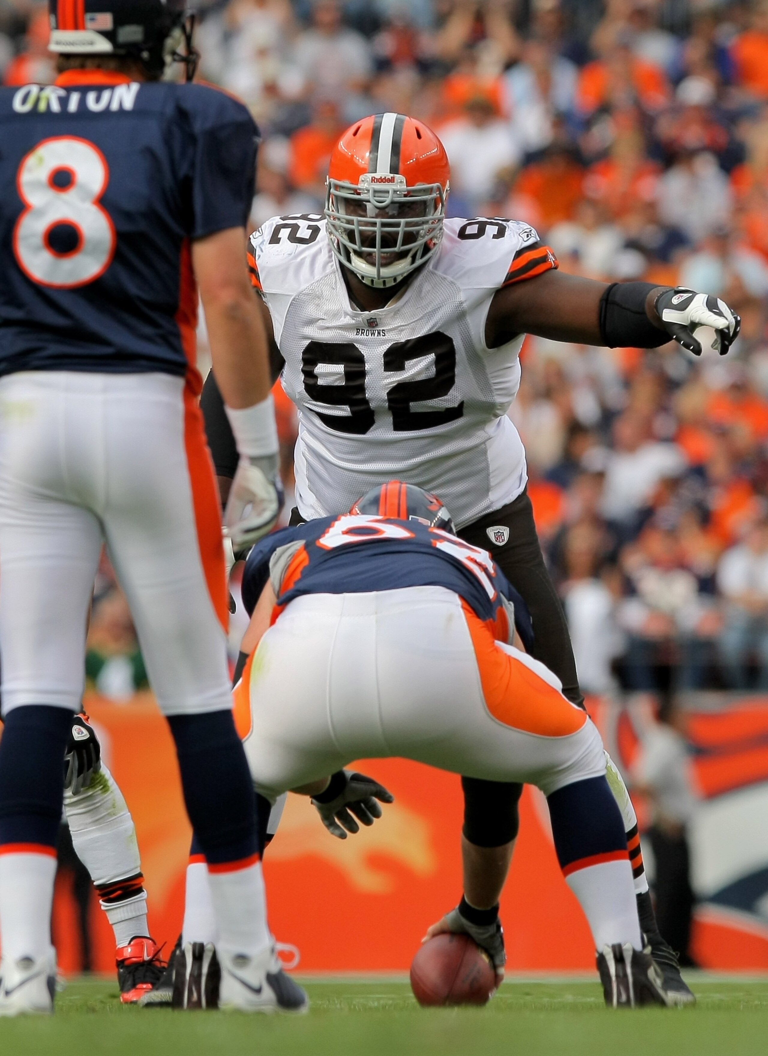 DENVER - SEPTEMBER 20:  Defensive lineman Shaun Rogers #92 of the Cleveland Browns prepares to rush quarterback Kyle Orton #8 against center Casey Wiegmann #62 of the Denver Broncos during NFL action at Invesco Field at Mile High on September 20, 2009 in
