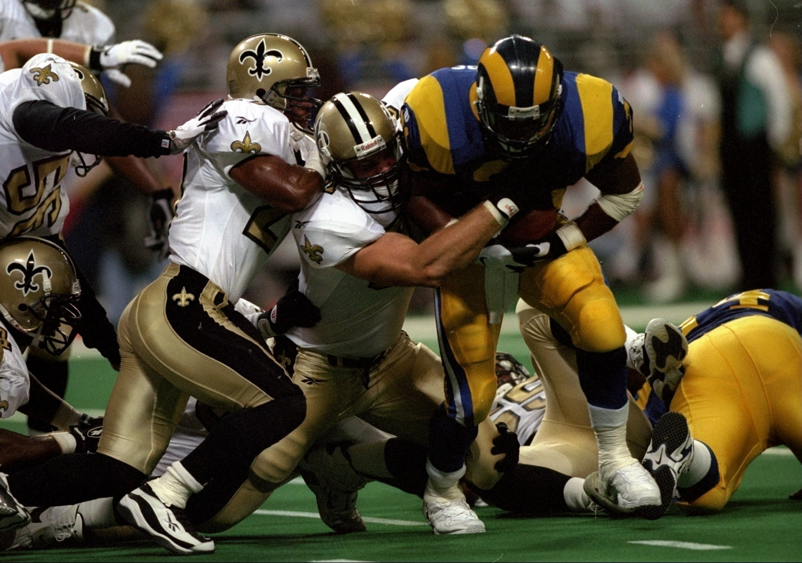 31 Aug 1997:  Running back Lawrence Phillips of the St. Louis Rams runs through the New Orleans defense to score a touchdown during the Rams 38-24 win at the Trans World Dome in St. Louis, Missouri. Mandatory Credit: Stephen Dunn  /Allsport