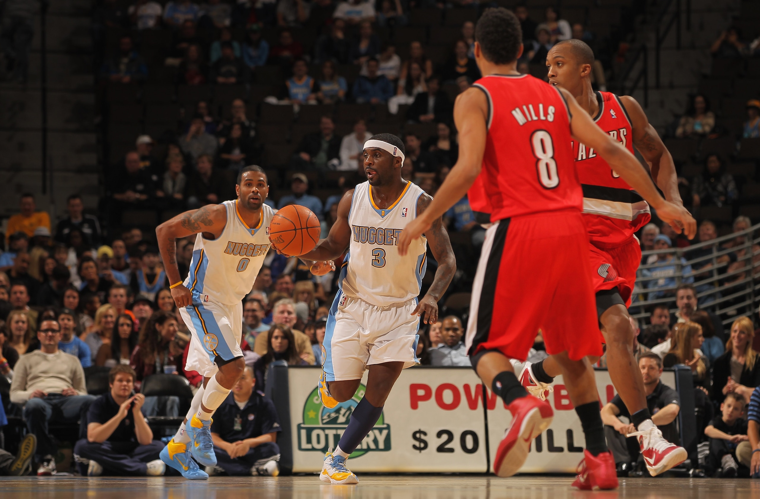DENVER - DECEMBER 28:  Ty Lawson #3 of the Denver Nuggets dribbles the ball against the Portland Trail Blazers at Pepsi Center on December 28, 2010 in Denver, Colorado. The Nuggets defeated the Blazers 95-77. NOTE TO USER: User expressly acknowledges and 