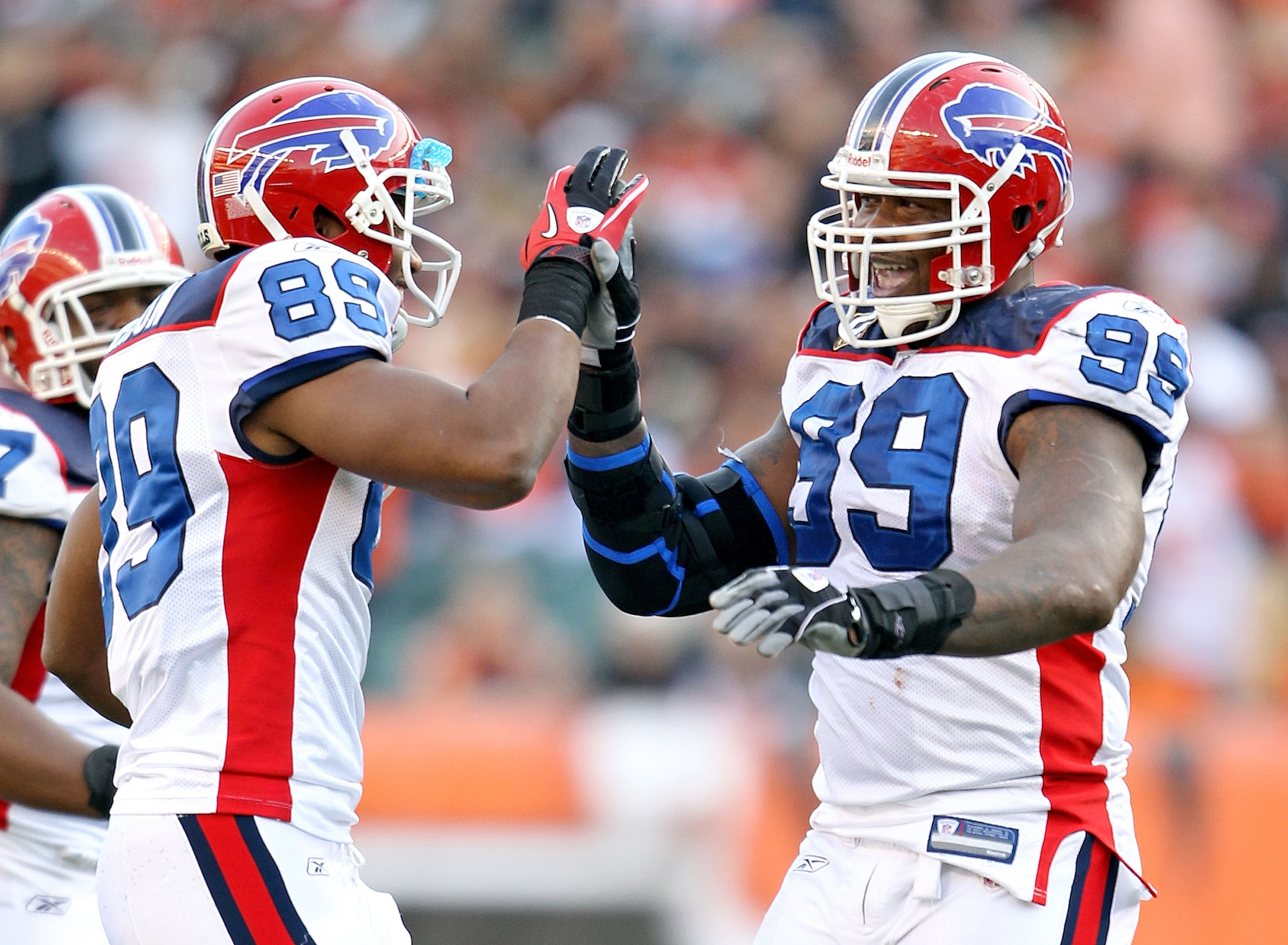 CINCINNATI - NOVEMBER 21:  Marcus Stroud #99 and Shawn Nelson #89 of the Buffalo Bills celebrate during NFL game against the Cincinnati Bengals at Paul Brown Stadium on November 21, 2010 in Cincinnati, Ohio. The Bills won 49-21.  (Photo by Andy Lyons/Gett