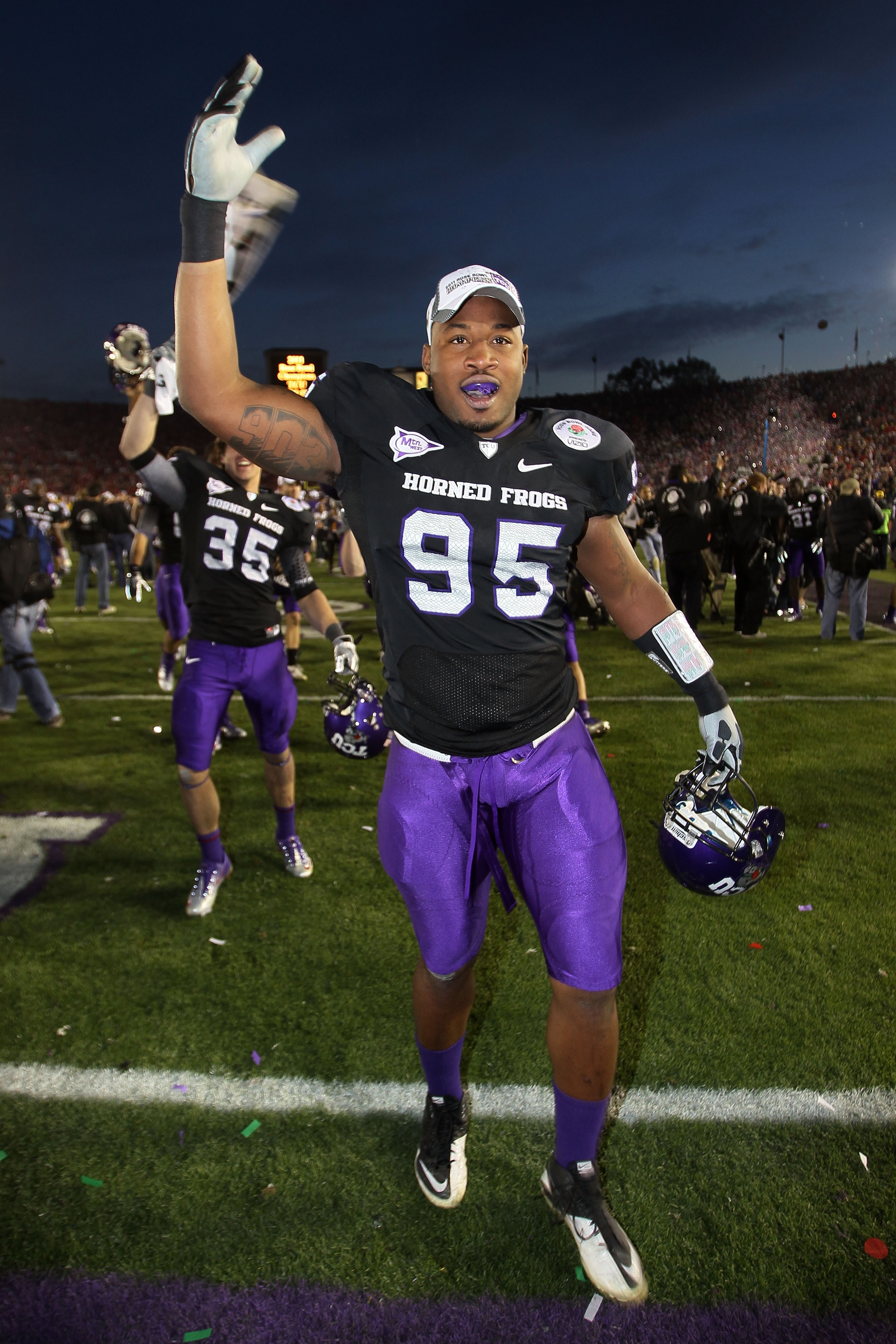 PASADENA, CA - JANUARY 01:  Clarence Leatch #95 of the TCU Horned Frogs celebrates after defeating the Wisconsin Badgers 21-19 in the 97th Rose Bowl game on January 1, 2011 in Pasadena, California.  (Photo by Stephen Dunn/Getty Images)