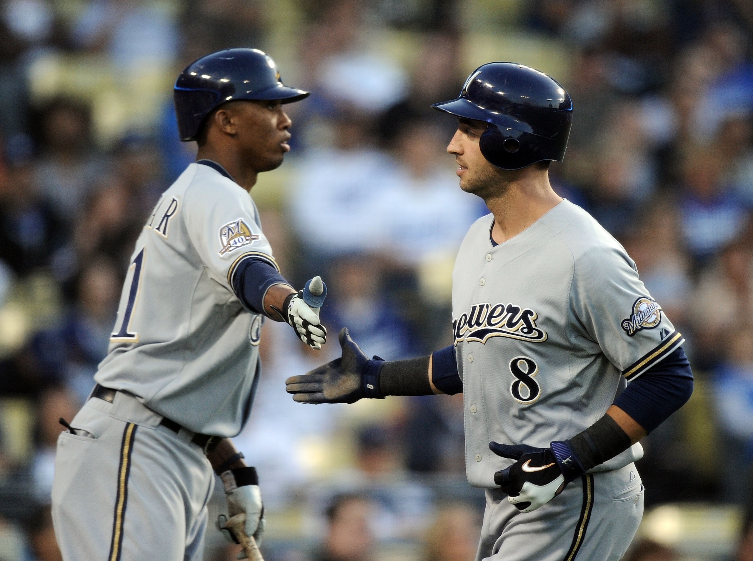 LOS ANGELES, CA - MAY 05: Ryan Braun #8 of the Milwaukee Brewers celebrates his run off a wild pitch with Alcides Escobar #21 against the Los Angeles Dodgers during the first inning at Dodger Stadium on May 5, 2010 in Los Angeles, California. (Photo by LOS ANGELES, CA - MAY 05: Ryan Braun #8 of the Milwaukee Brewers celebrates his run off a wild pitch with Alcides Escobar #21 against the Los Angeles Dodgers during the first inning at Dodger Stadium on May 5, 2010 in Los Angeles, California. (Photo by
