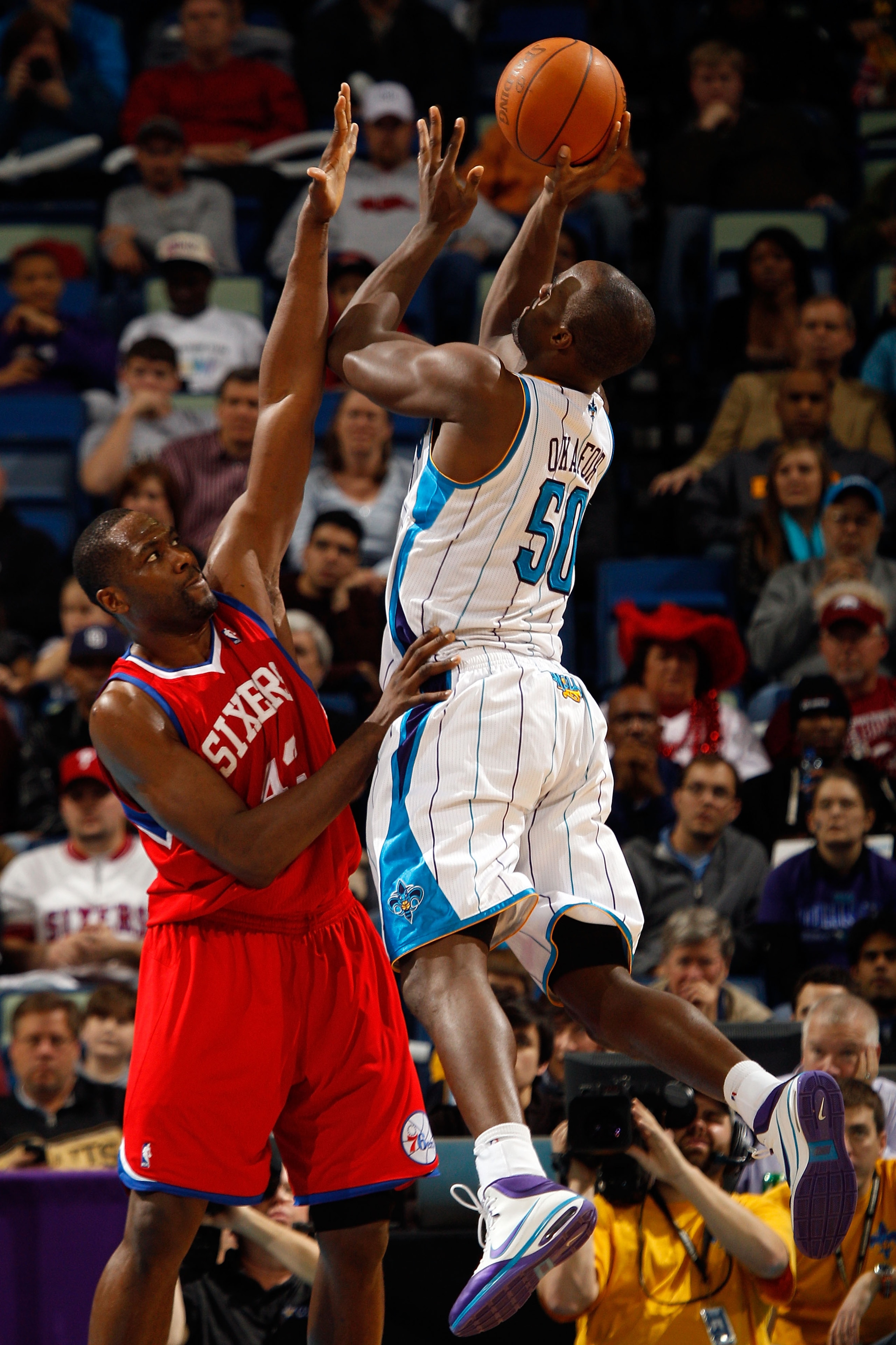 NEW ORLEANS, LA - JANUARY 03:  Emeka Okafor #50 of the New Orleans Hornets shoots over Elton Brand #42 of the Philadelphia 76ers in the second half at New Orleans Arena on January 3, 2011 in New Orleans, Louisiana. NOTE TO USER: User expressly acknowledge