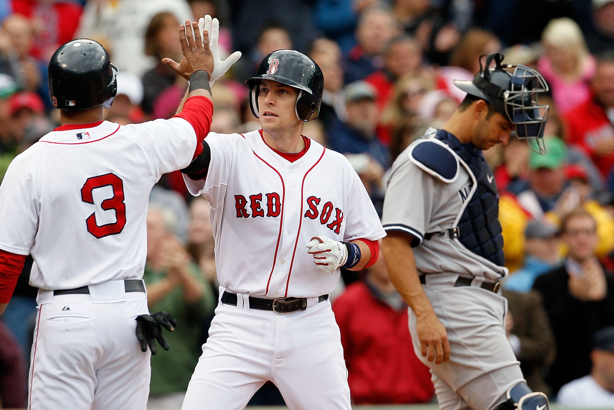 BOSTON - OCTOBER 3:  Jed Lowrie #12 of  the Boston Red Sox crosses home after hitting a home run against the New York Yankees at Fenway Park, October 3, 2010, in Boston, Massachusetts. (Photo by Jim Rogash/Getty Images)