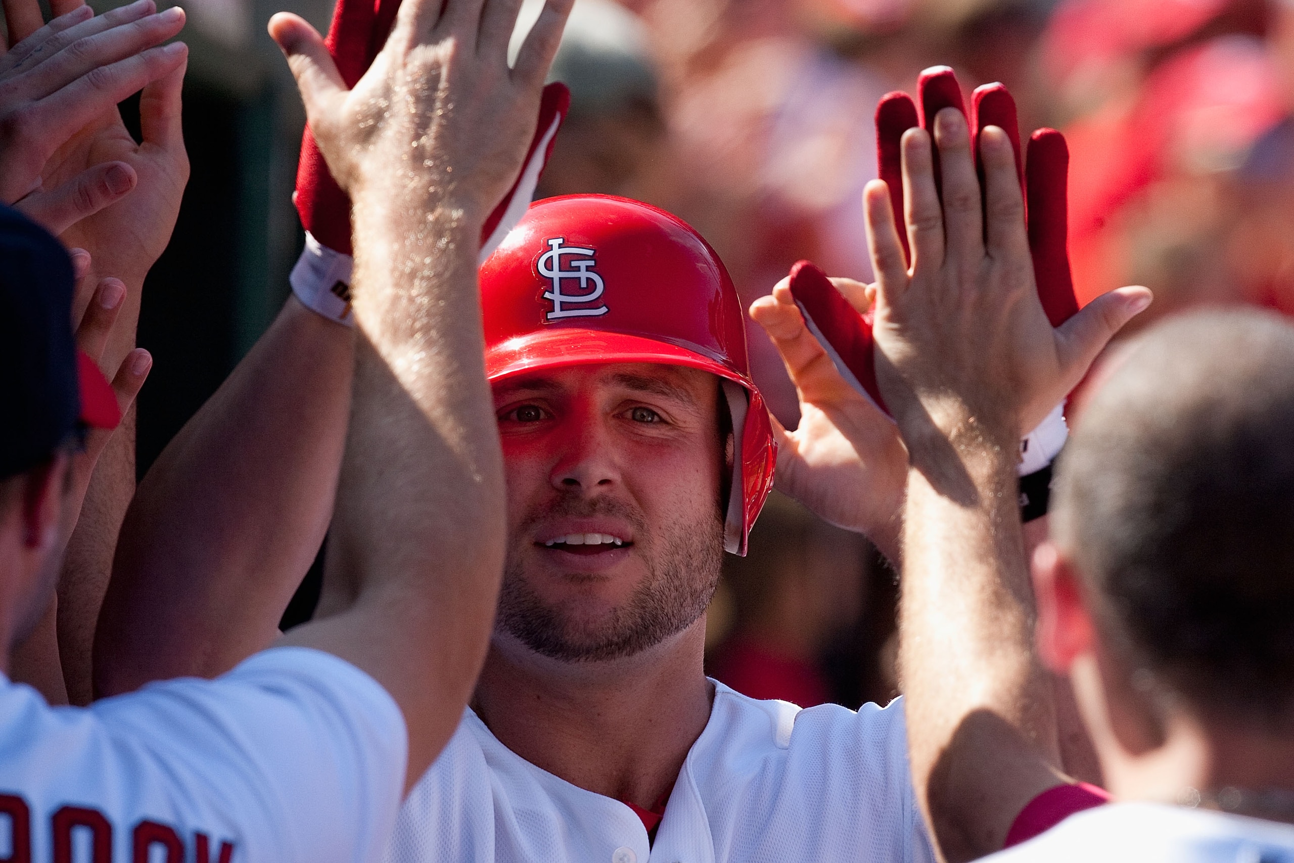 ST. LOUIS - SEPTEMBER 5: Matt Holliday #7 of the St. Louis Cardinals is congratulated by teammates after hitting a three-run home run against the Cincinnati Reds at Busch Stadium on September 5, 2010 in St. Louis, Missouri. The Cardinals beat the Reds 4- ST. LOUIS - SEPTEMBER 5: Matt Holliday #7 of the St. Louis Cardinals is congratulated by teammates after hitting a three-run home run against the Cincinnati Reds at Busch Stadium on September 5, 2010 in St. Louis, Missouri. The Cardinals beat the Reds 4-