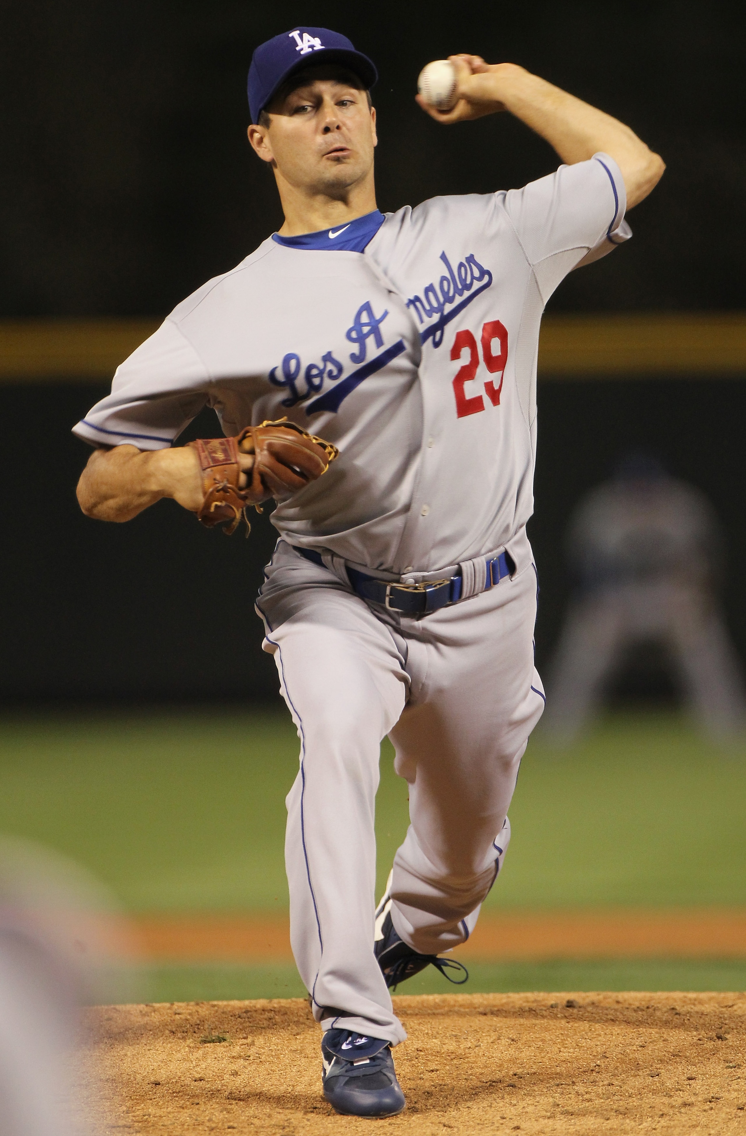 DENVER - SEPTEMBER 27:  Starting pitcher Ted Lilly #29 of the Los Angeles Dodgers delivers against the Colorado Rockies at Coors Field on September 25, 2010 in Denver, Colorado.  (Photo by Doug Pensinger/Getty Images)