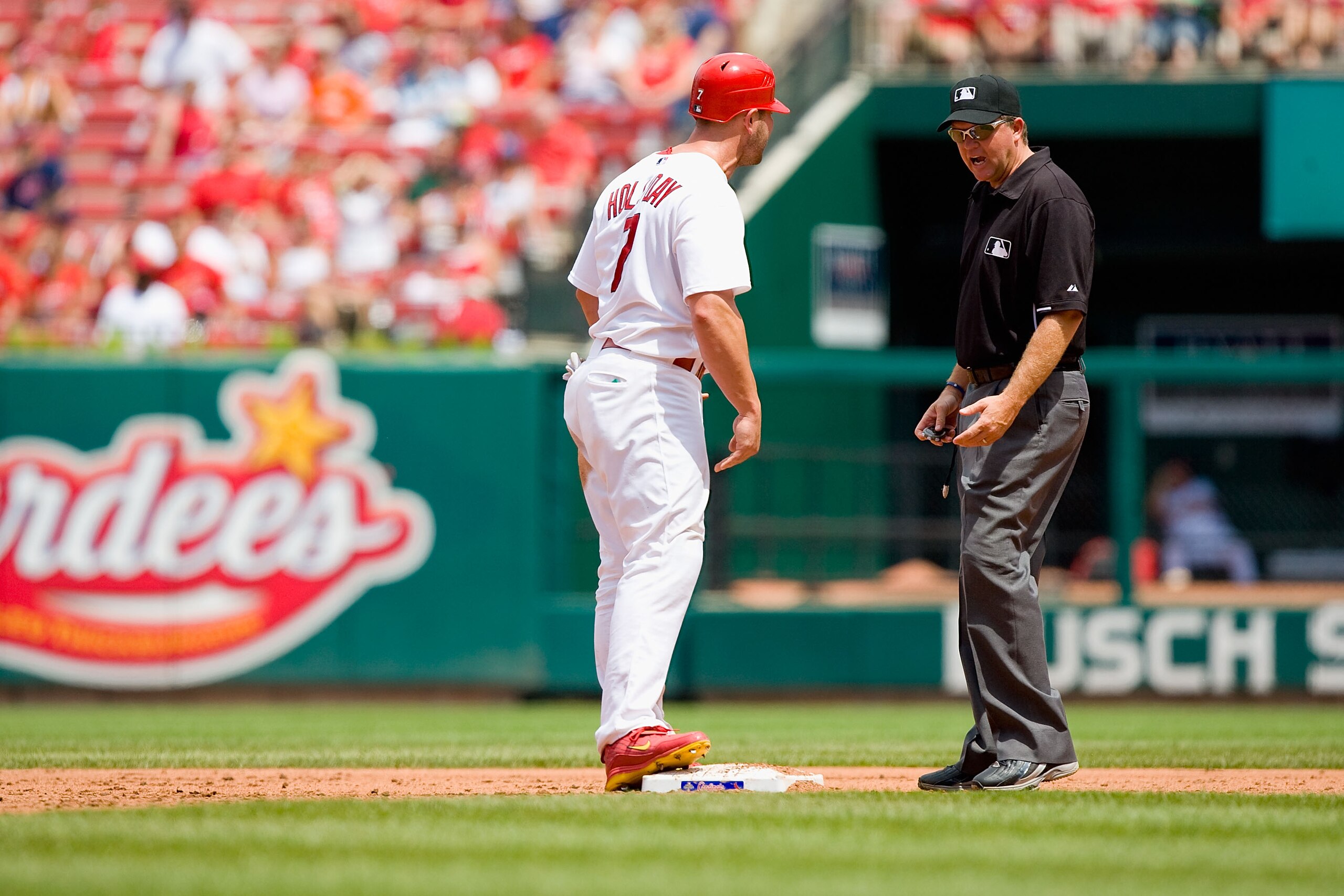 ST. LOUIS - JULY 18: Matt Holliday #7 of the St. Louis Cardinals talks with umpire Ron Kulpa #46 during a game against the Los Angeles Dodgers at Busch Stadium on July 18, 2010 in St. Louis, Missouri. (Photo by Dilip Vishwanat/Getty Images) ST. LOUIS - JULY 18: Matt Holliday #7 of the St. Louis Cardinals talks with umpire Ron Kulpa #46 during a game against the Los Angeles Dodgers at Busch Stadium on July 18, 2010 in St. Louis, Missouri. (Photo by Dilip Vishwanat/Getty Images)