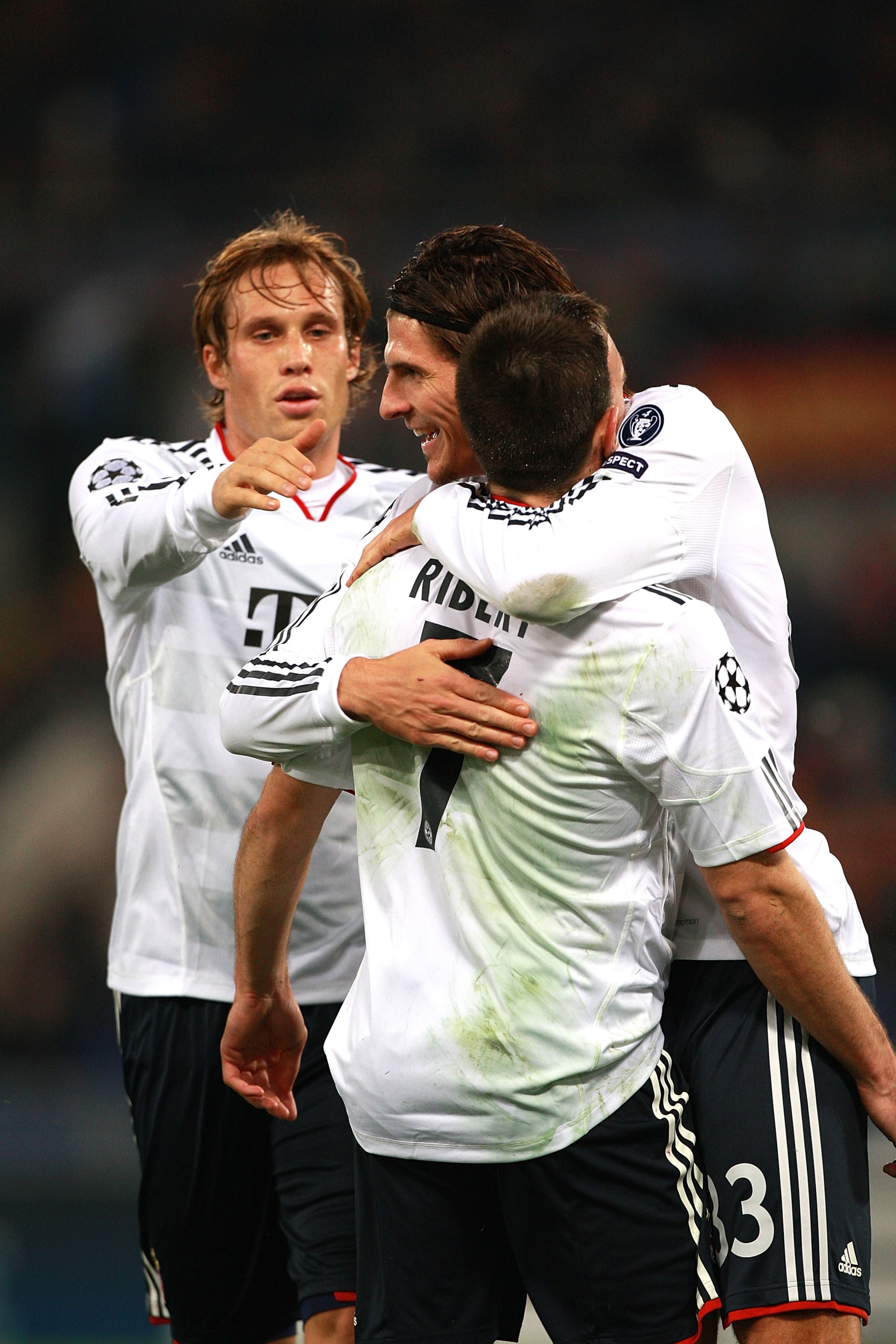ROME - NOVEMBER 23: Mario Gomez (C) with his teammate Franck Ribery #7 and Andreas Ottl of FC Bayern Muenchen celebrates after scoring the opening goal during the UEFA Champions League Group E match between AS Roma and FC Bayern Muenchen at Stadio Olimpi ROME - NOVEMBER 23: Mario Gomez (C) with his teammate Franck Ribery #7 and Andreas Ottl of FC Bayern Muenchen celebrates after scoring the opening goal during the UEFA Champions League Group E match between AS Roma and FC Bayern Muenchen at Stadio Olimpi