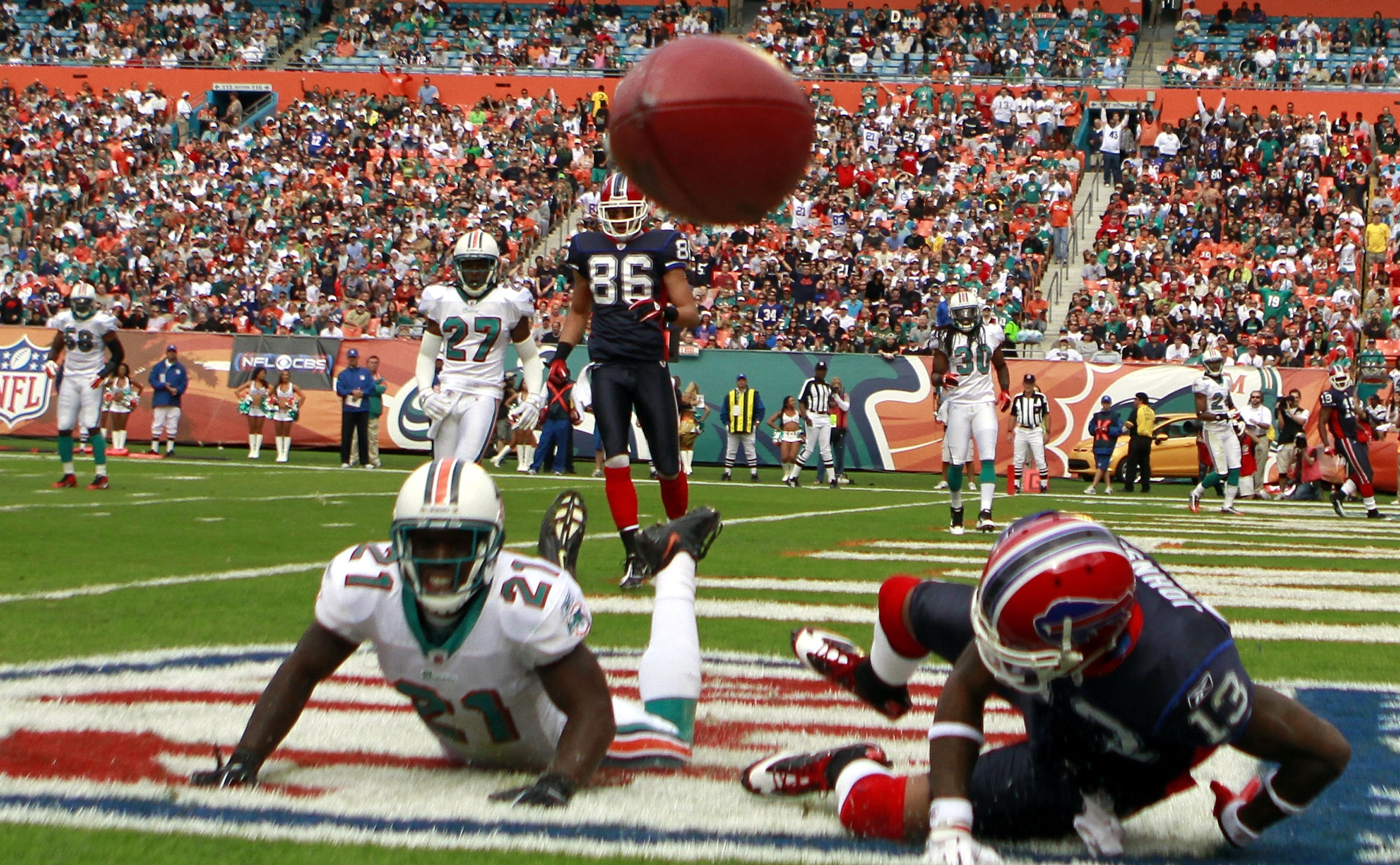MIAMI - DECEMBER 19:  Defensive back Vontae Davis #21 of the Miami Dolphins breaks up a catch against receiver Steve Johnson #13 of the Buffalo Bills at Sun Life Stadium on December 19, 2010 in Miami, Florida. The Bills defeated the Dolphins 17-14.  (Phot