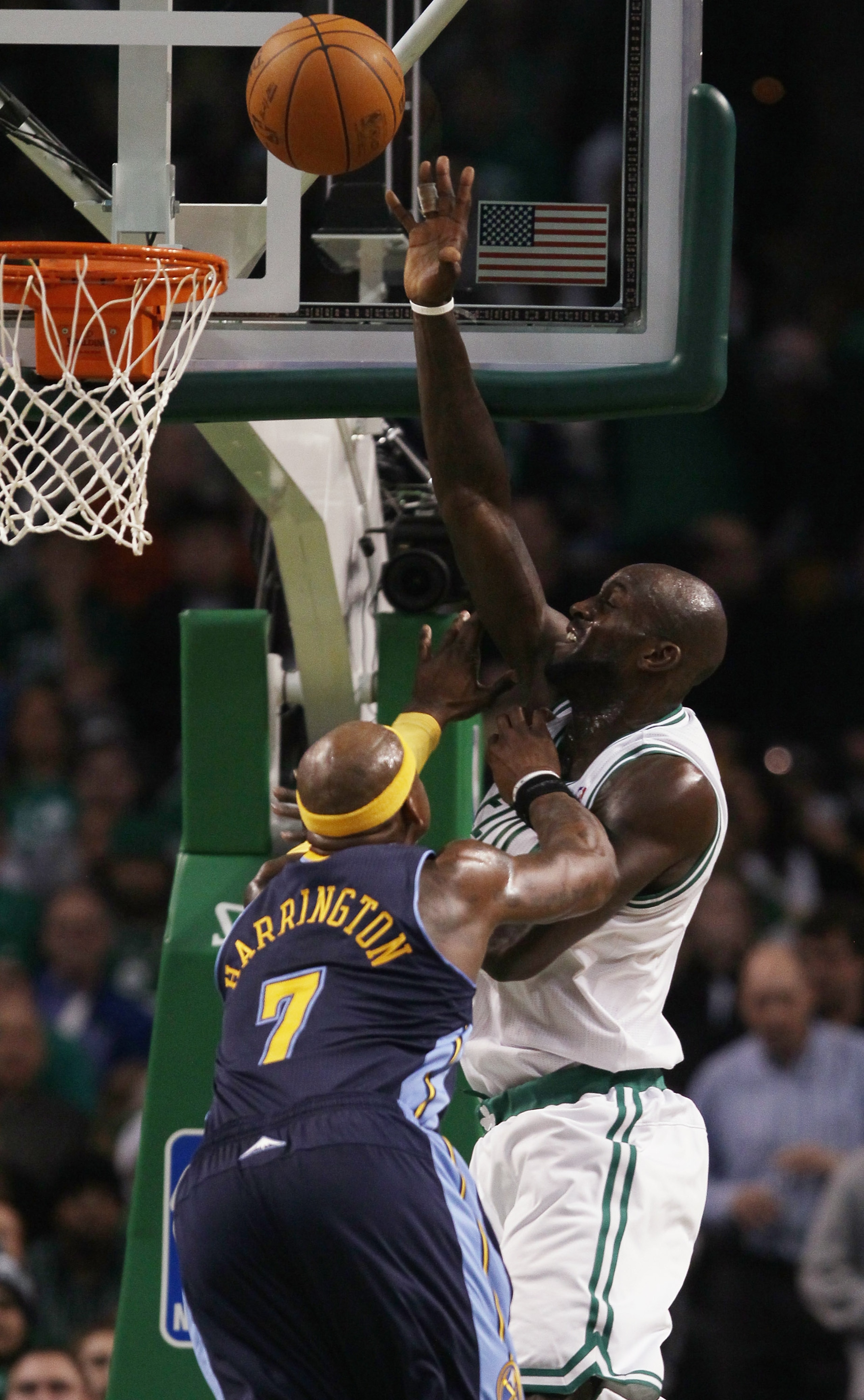 BOSTON, MA - DECEMBER 08:  Kevin Garnett #5 of the Boston Celtics is fouled by Al Harrington #7 of the Denver Nuggets on December 8, 2010 at the TD Garden in Boston, Massachusetts. The Celtics defeated the Nuggets 105-89. NOTE TO USER: User expressly ackn