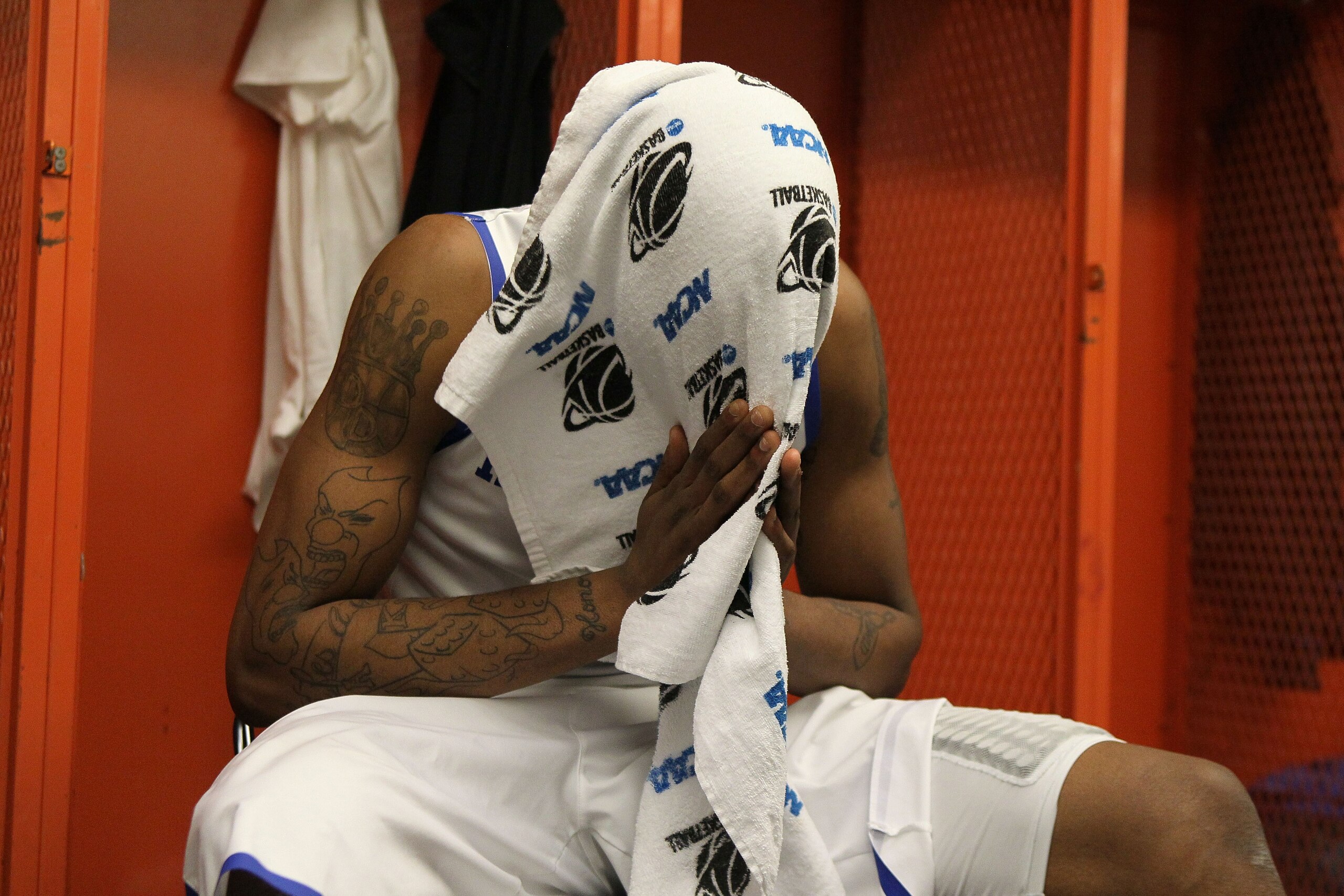 SYRACUSE, NY - MARCH 27: Darnell Dodson #3 of the Kentucky Wildcats sits in the locker room dejected after they lost 73-66 against the West Virginia Mountaineers during the east regional final of the 2010 NCAA men's basketball tournament at the Carrier D SYRACUSE, NY - MARCH 27: Darnell Dodson #3 of the Kentucky Wildcats sits in the locker room dejected after they lost 73-66 against the West Virginia Mountaineers during the east regional final of the 2010 NCAA men's basketball tournament at the Carrier D