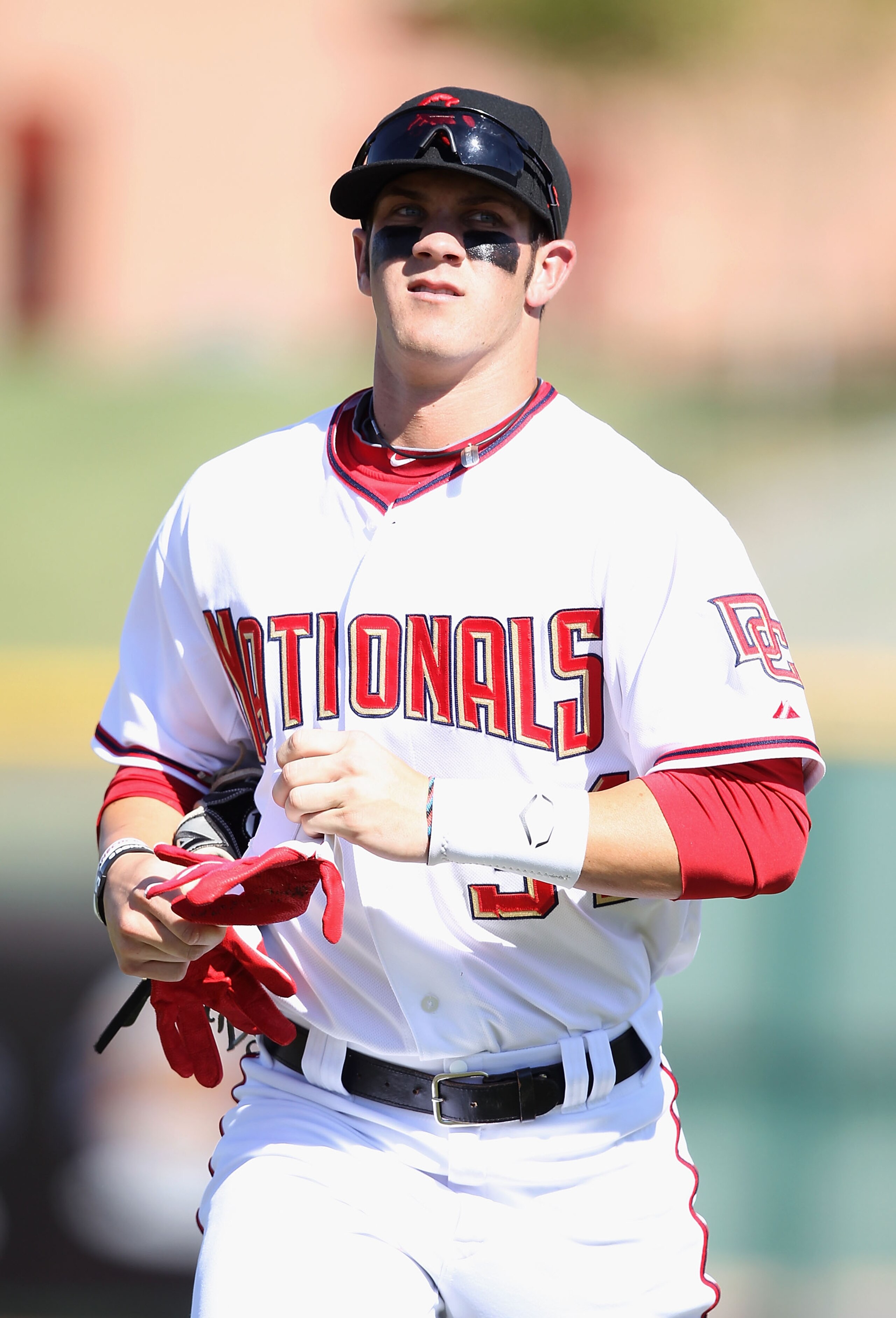 SCOTTSDALE, AZ - OCTOBER 23: Washington Nationals prospect Bryce Harper #34 playing for the Scottsdale Scorpions runs in from the outfield during the AZ Fall League game against the Phoenix Desert Dogs at Scottsdale Stadium on October 23, 2010 in Scottsd SCOTTSDALE, AZ - OCTOBER 23: Washington Nationals prospect Bryce Harper #34 playing for the Scottsdale Scorpions runs in from the outfield during the AZ Fall League game against the Phoenix Desert Dogs at Scottsdale Stadium on October 23, 2010 in Scottsd