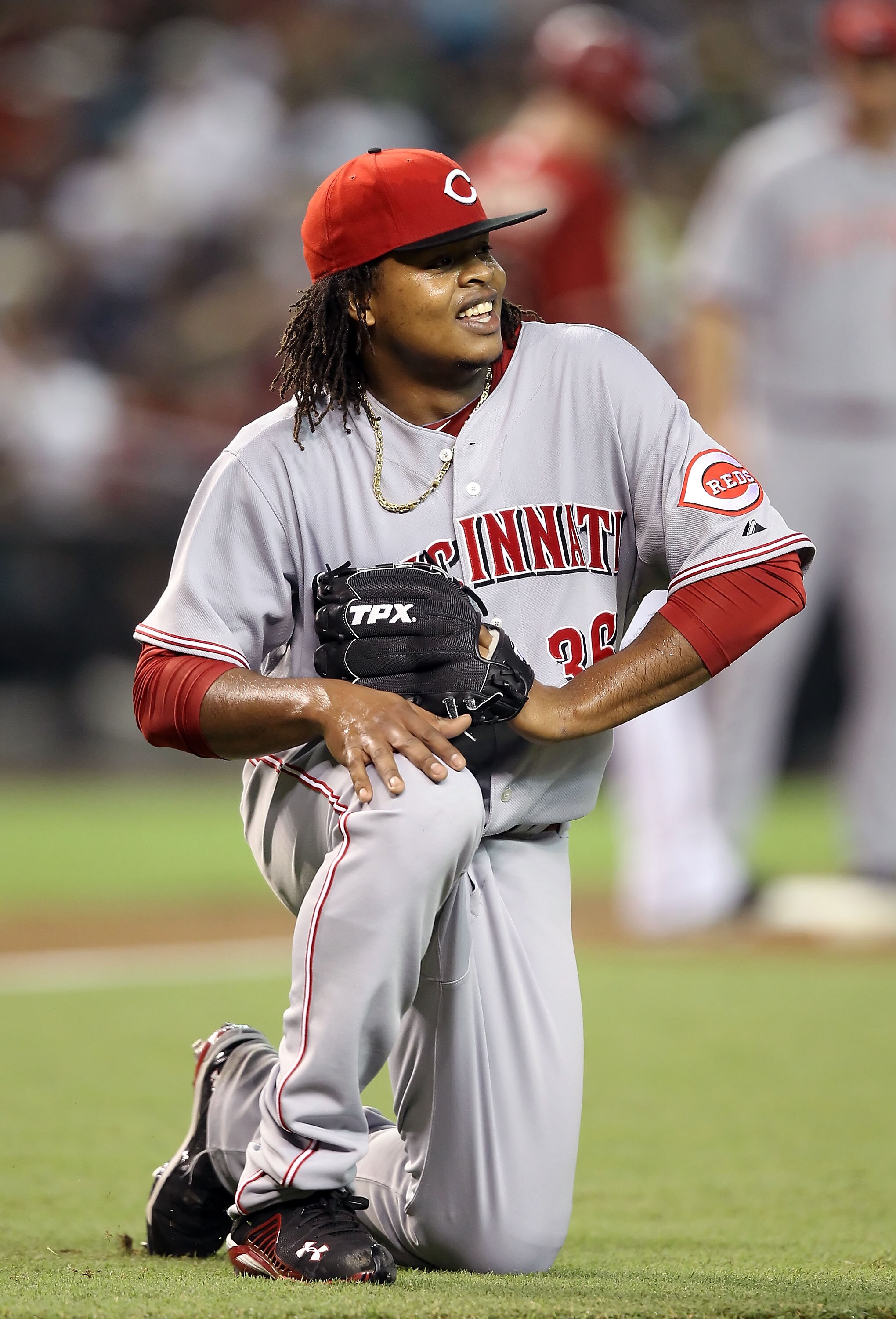 PHOENIX - AUGUST 18:  Starting pitcher Edinson Volquez #36 of the Cincinnati Reds reacts after fielding a ground ball out against the Arizona Diamondbacks during the Major League Baseball game at Chase Field on August 18, 2010 in Phoenix, Arizona.  (Photo