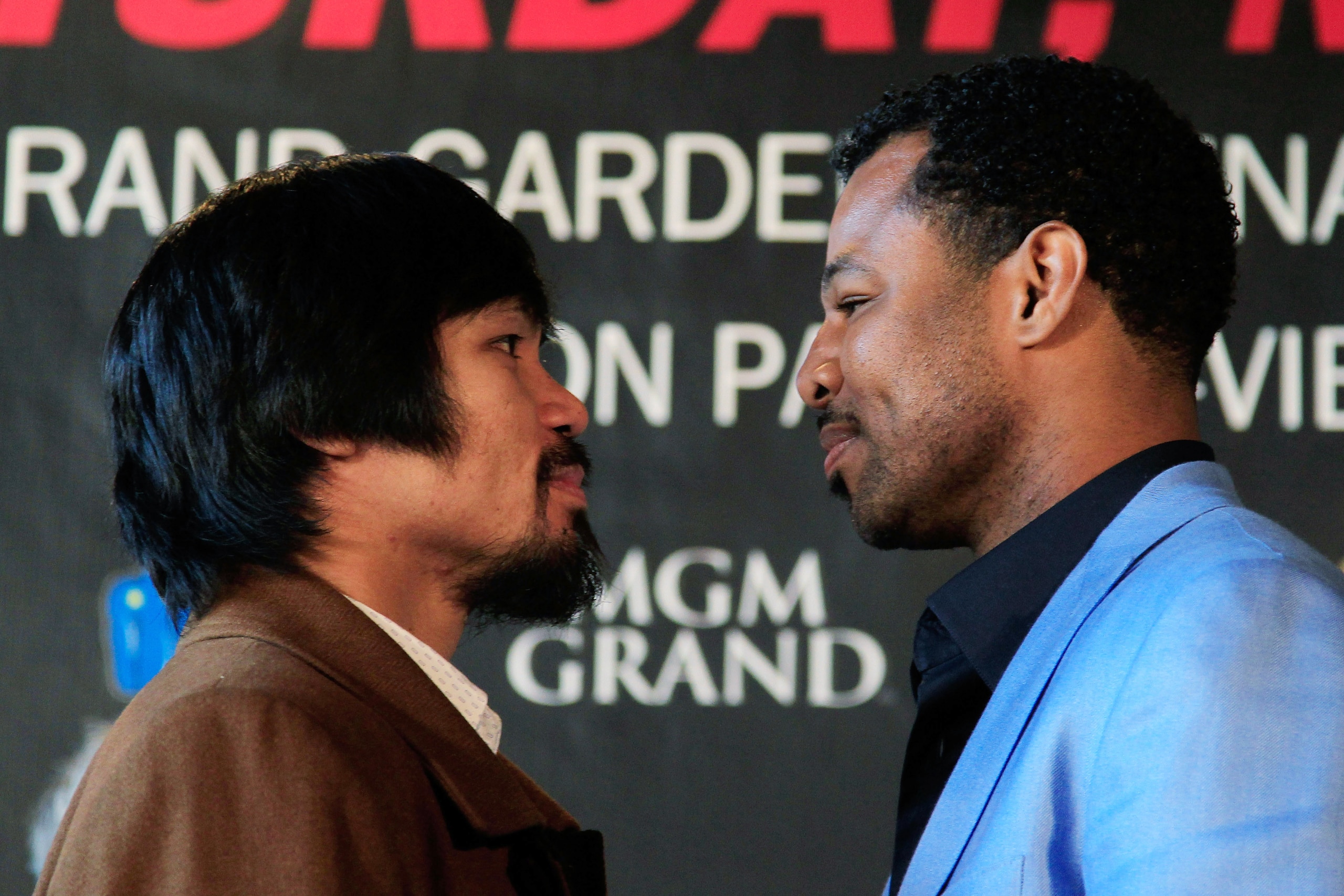 NEW YORK, NY - FEBRUARY 14:  (L) Manny Pacquiao and (R) Shane Mosley square up at a press conference to promote their upcoming fight at The Lighthouse at Chelsea Piers on February 14, 2011 in New York City.  (Photo by Chris Trotman/Getty Images)