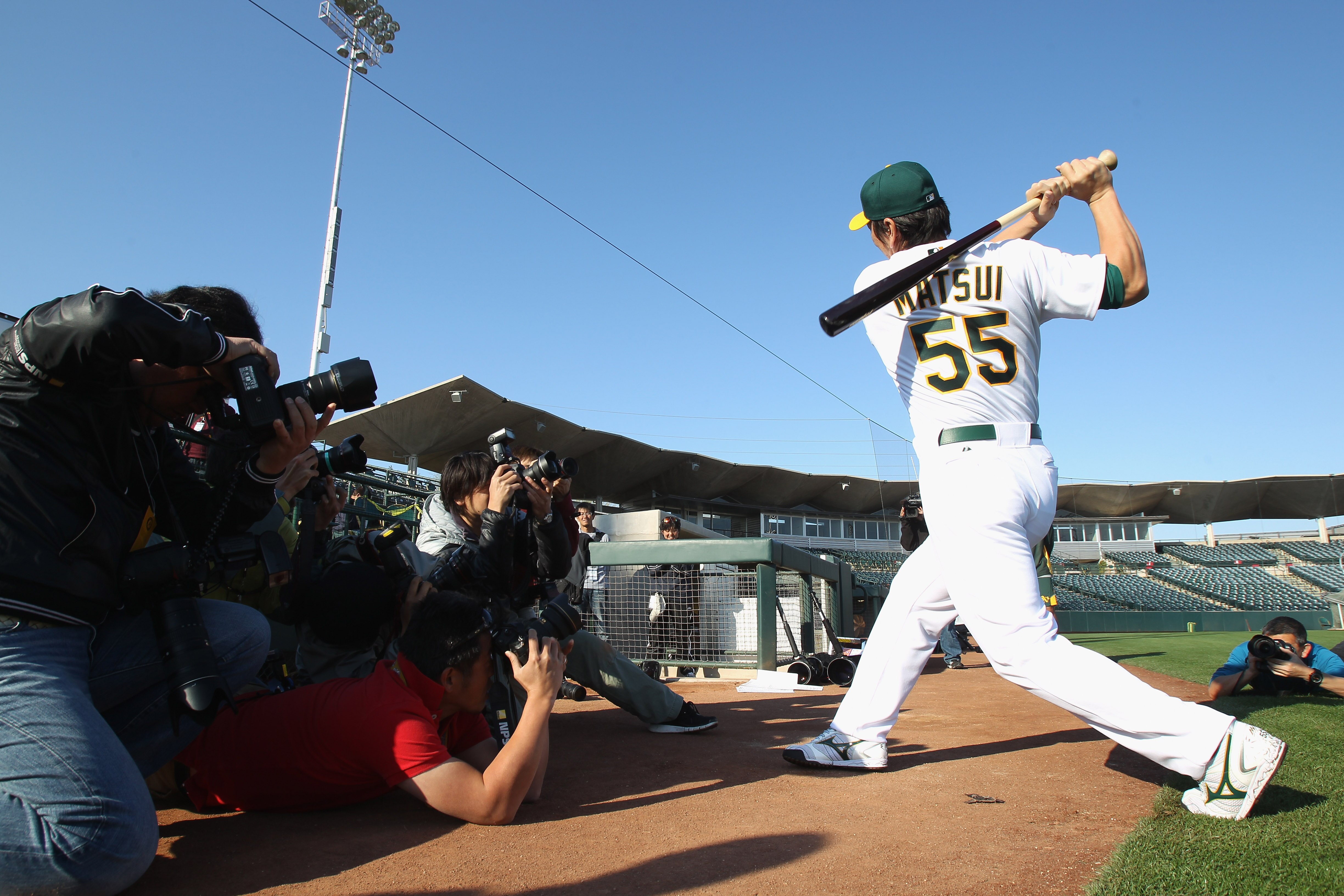 PHOENIX, AZ - FEBRUARY 24:  Hideki Matsui #55 of the Oakland Athletics is surrounded by photographers during media photo day at Phoenix Municipal Stadium on February 24, 2011 in Phoenix, Arizona.  (Photo by Ezra Shaw/Getty Images)