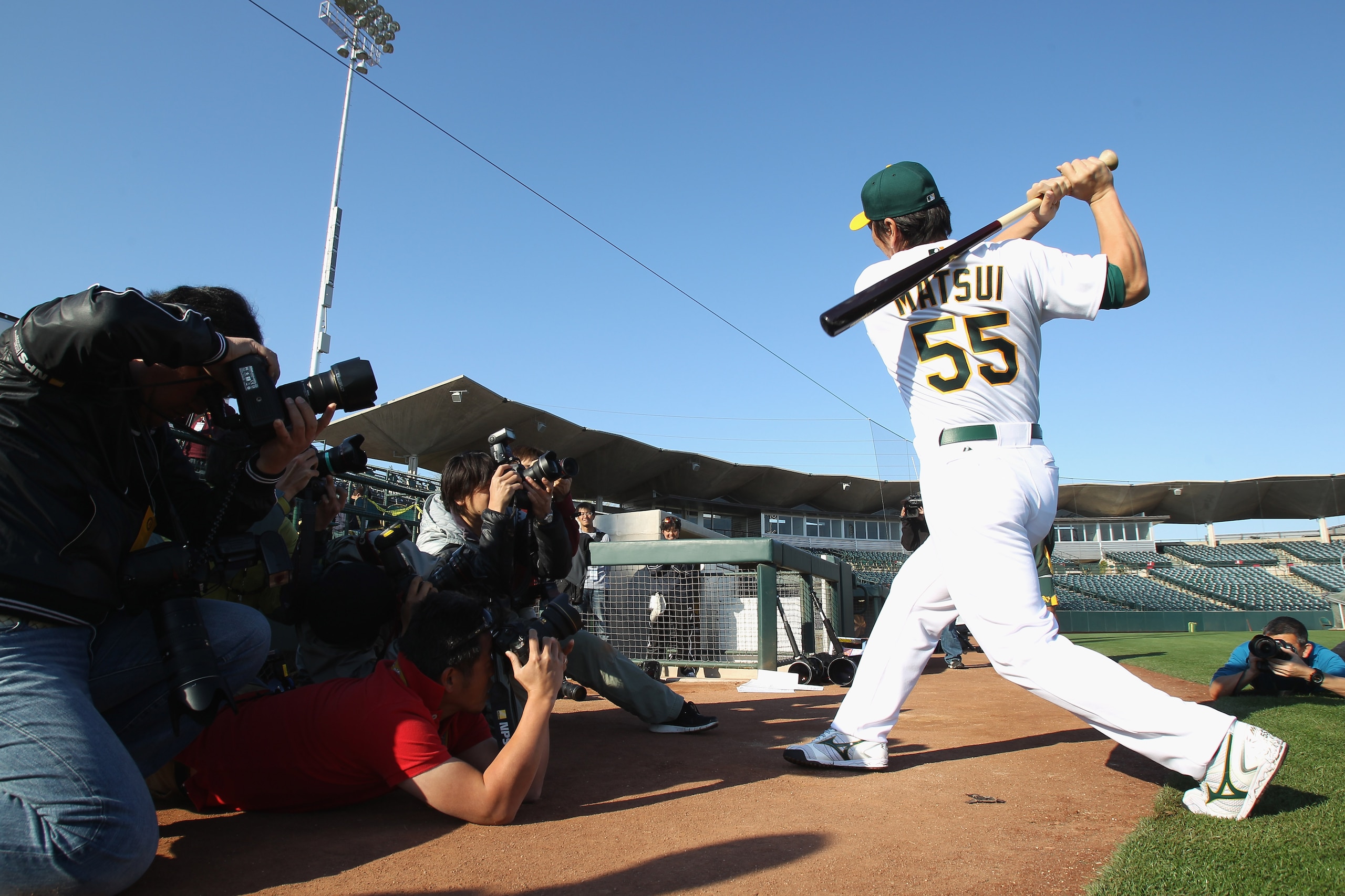 PHOENIX, AZ - FEBRUARY 24: Hideki Matsui #55 of the Oakland Athletics is surrounded by photographers during media photo day at Phoenix Municipal Stadium on February 24, 2011 in Phoenix, Arizona. (Photo by Ezra Shaw/Getty Images) PHOENIX, AZ - FEBRUARY 24: Hideki Matsui #55 of the Oakland Athletics is surrounded by photographers during media photo day at Phoenix Municipal Stadium on February 24, 2011 in Phoenix, Arizona. (Photo by Ezra Shaw/Getty Images)