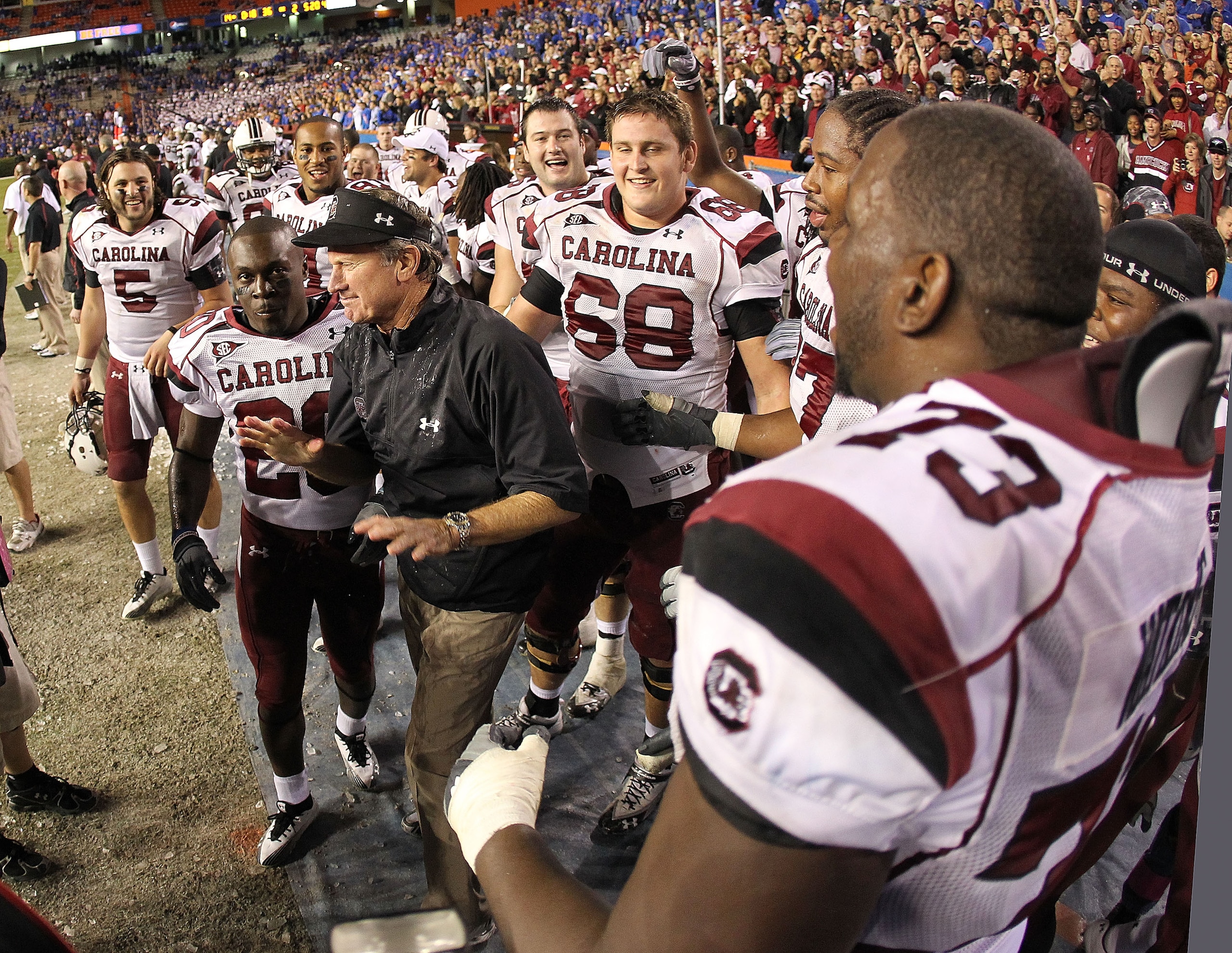 GAINESVILLE, FL - NOVEMBER 13:  South Carolina Gamecocks head coach Steve Spurrier greets his players after winning a game against the Florida Gators at Ben Hill Griffin Stadium on November 13, 2010 in Gainesville, Florida. The Gamecocks beat the Gators 3