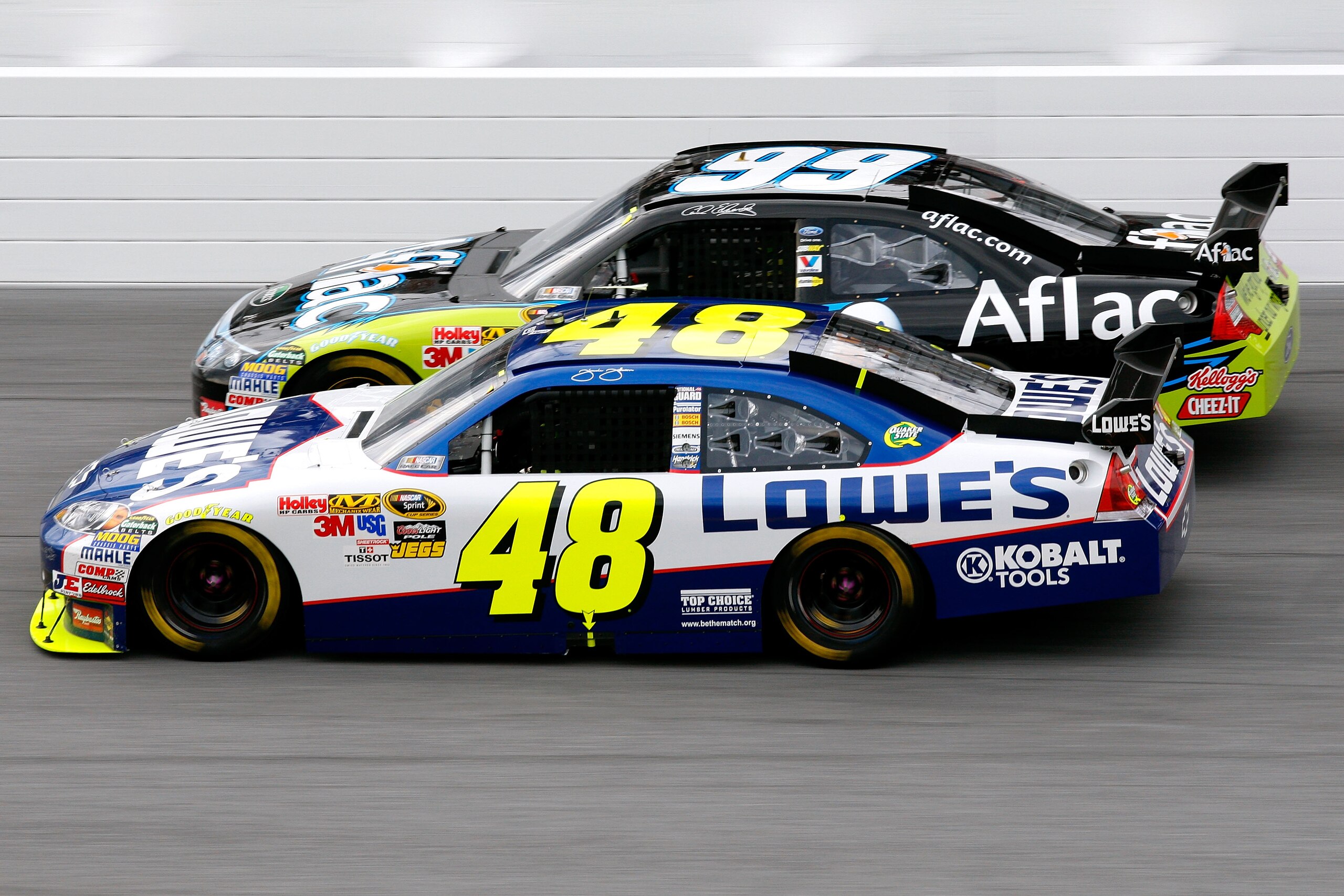 DAYTONA BEACH, FL - FEBRUARY 11:  Jimmie Johnson, driver of the #48 Lowe's Chevrolet, races Carl Edwards, driver of the #99 Aflac Ford, during the first NASCAR Sprint Cup Series Gatorade Duel at Daytona International Speedway on February 11, 2010 in Dayto