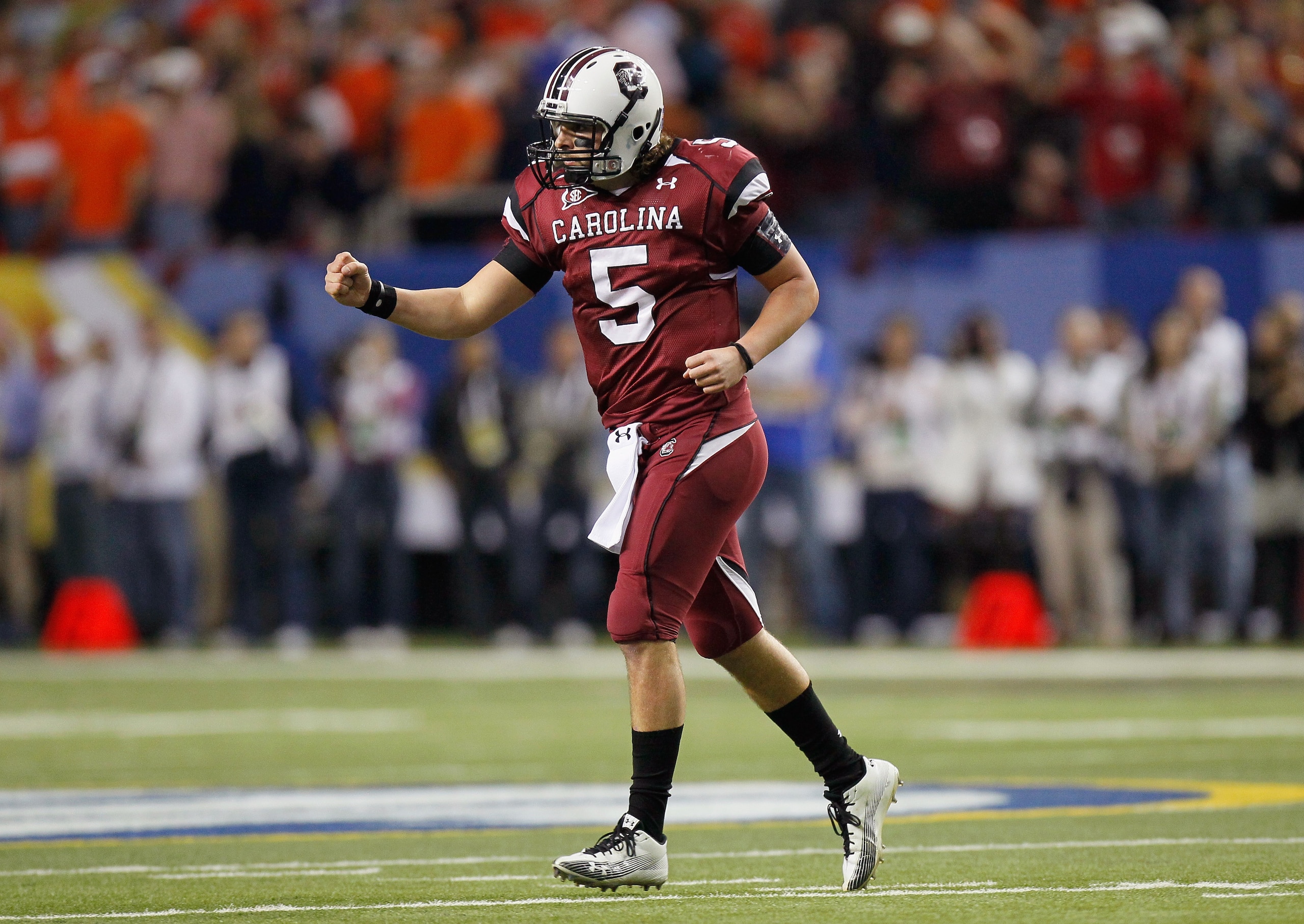 ATLANTA, GA - DECEMBER 04:  Quarterback Stephen Garcia #5 of the South Carolina Gamecocks reacts after passing for a touchdown against the Auburn Tigers during the 2010 SEC Championship at Georgia Dome on December 4, 2010 in Atlanta, Georgia.  (Photo by K