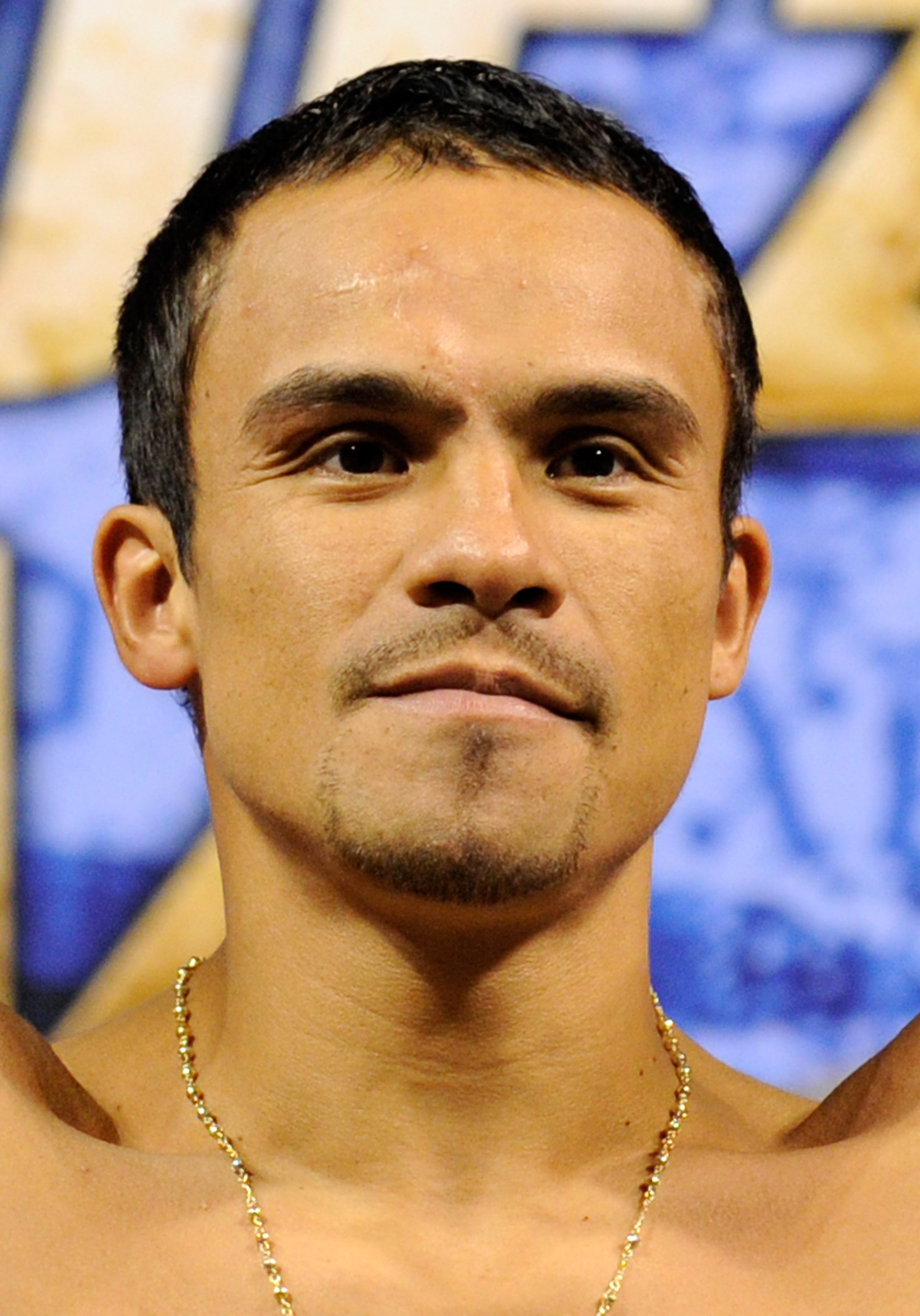 LAS VEGAS - JULY 30:  WBA/WBO lightweight champion Juan Manuel Marquez poses on the scale during the official weigh-in for his fight against Juan Diaz at the Mandalay Bay Events Center July 30, 2010 in Las Vegas, Nevada. Marquez will defend his titles aga