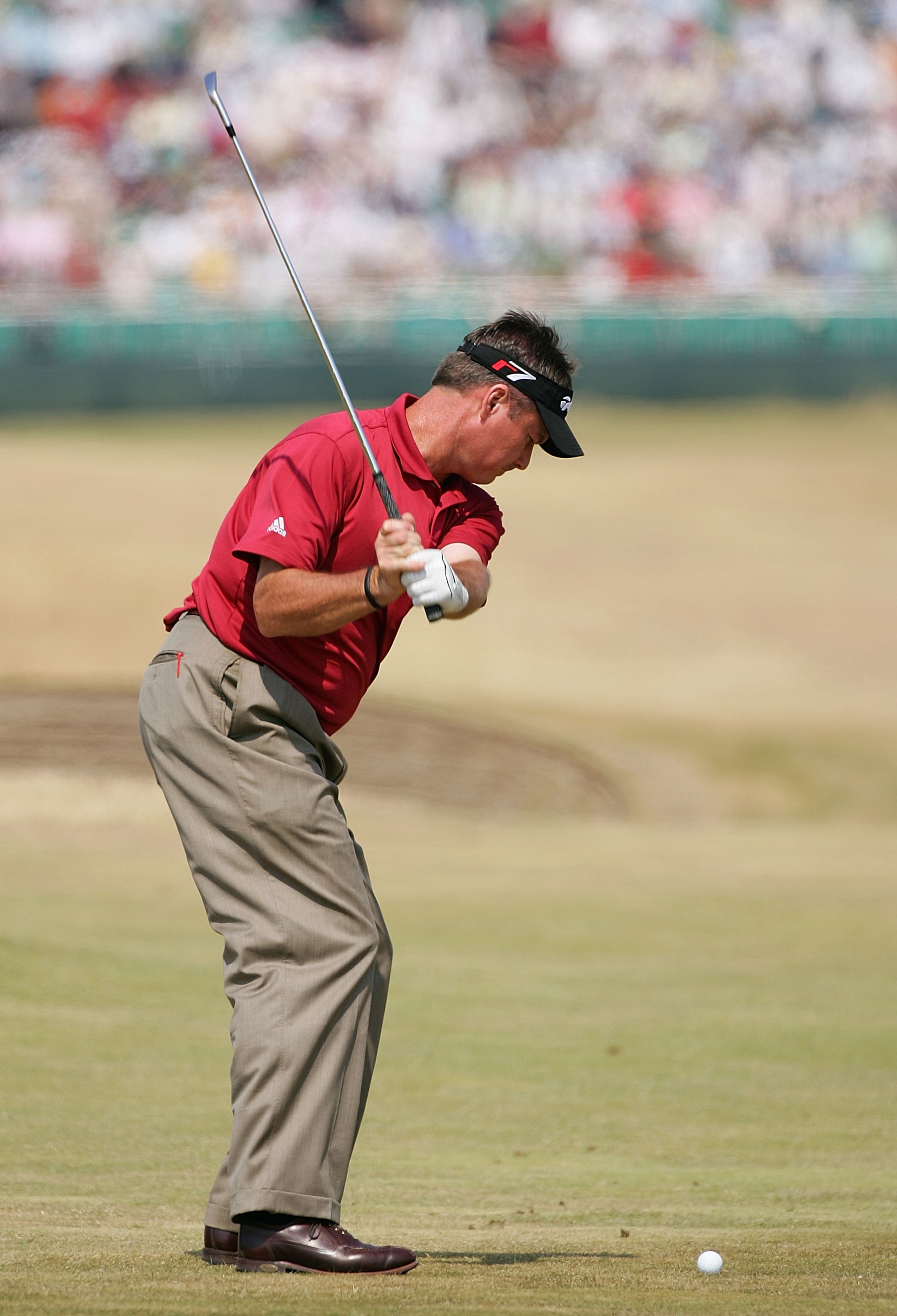 HOYLAKE, UNITED KINGDOM - JULY 20: Todd Hamilton of USA hits his approach shot on the 12th hole during the first round of The Open Championship at Royal Liverpool Golf Club on July 20, 2006 in Hoylake, England.  (Photo by Stuart Franklin/Getty Images)