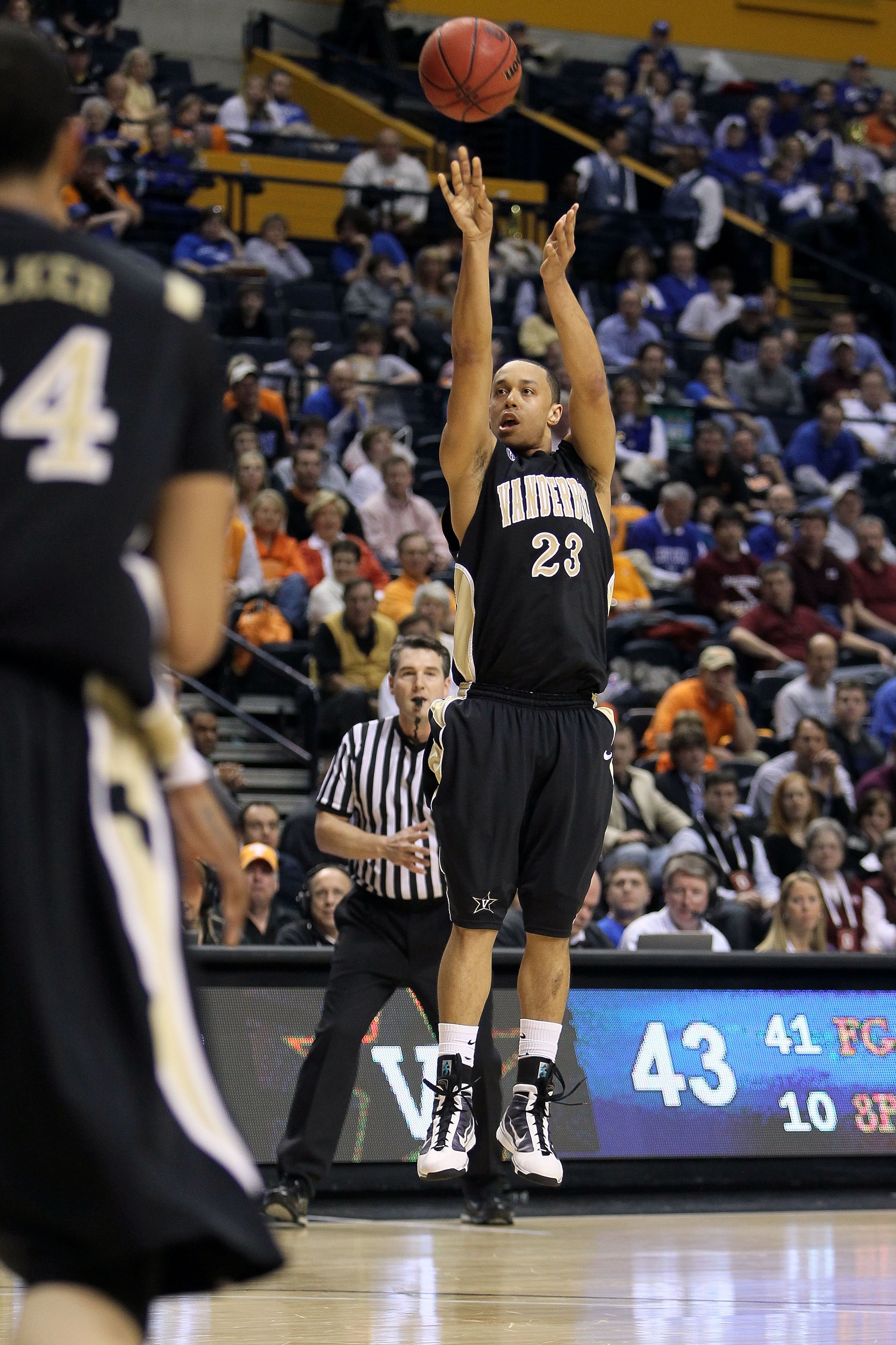NASHVILLE, TN - MARCH 13:  John Jenkins #23 of the Vanderbilt Commodores attempts a shot against the Mississippi State Bulldogs during the semifinals of the SEC Men's Basketball Tournament at the Bridgestone Arena on March 13, 2010 in Nashville, Tennessee