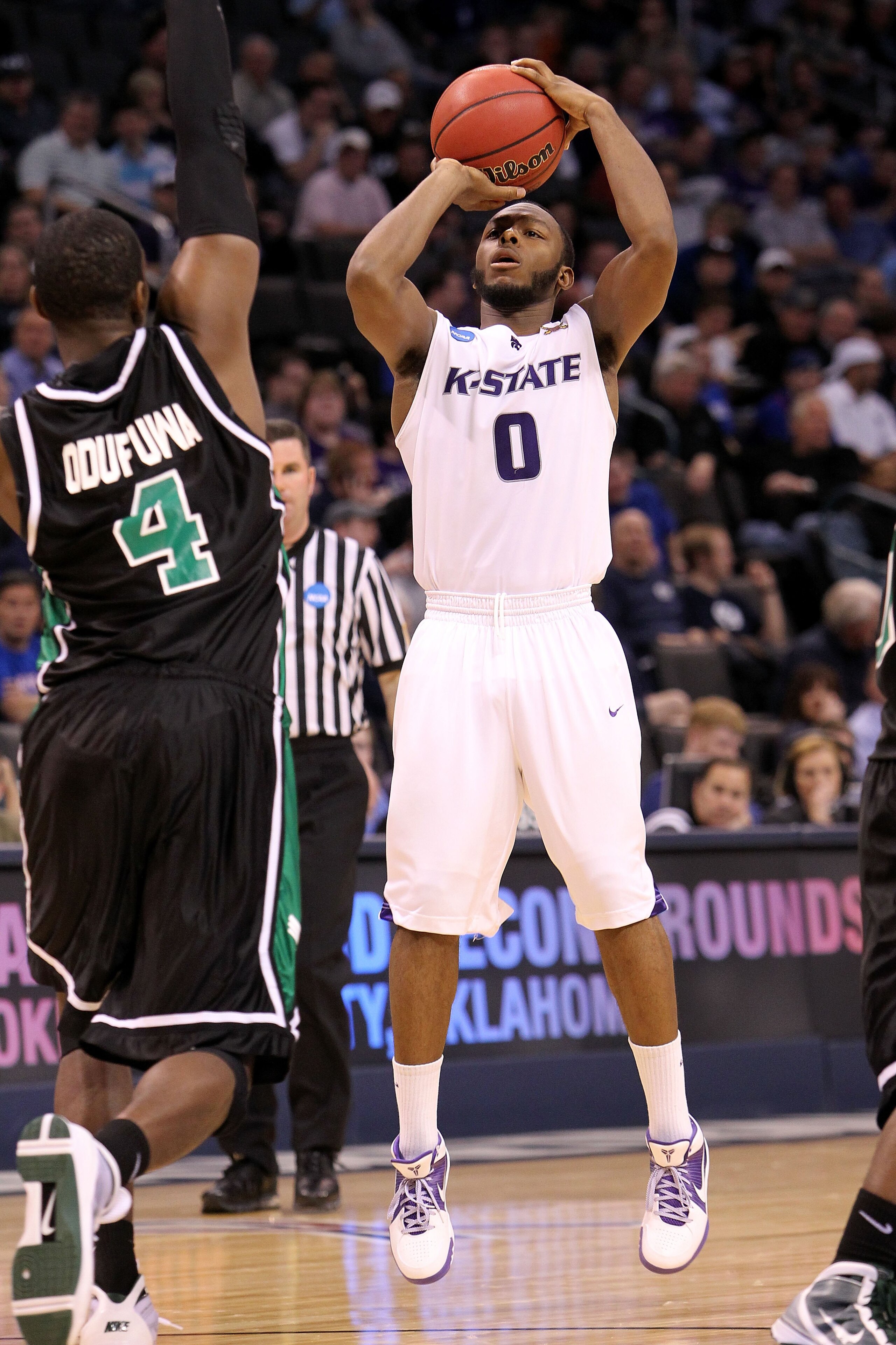 OKLAHOMA CITY - MARCH 18:  Jacob Pullen #0 of the Kansas State Wildcats attempts a shot against the North Texas Mean Green during the first round of the 2010 NCAA men's basketball tournament at Ford Center on March 18, 2010 in Oklahoma City, Oklahoma.  (P