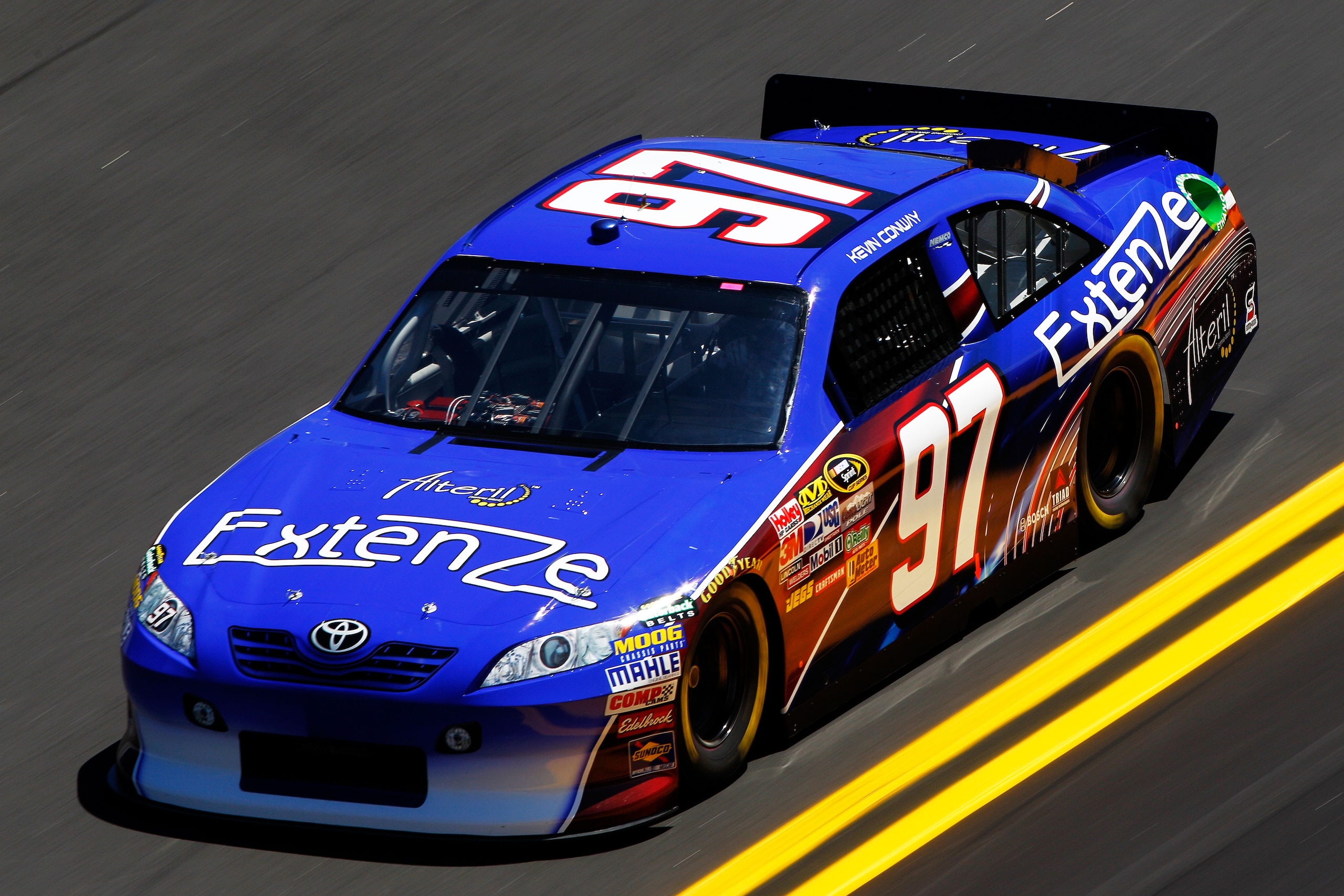 DAYTONA BEACH, FL - FEBRUARY 12:  Kevin Conway, driver of the #97 ExtenZe Toyota, practices for the NASCAR Sprint Cup Series Daytona 500 at Daytona International Speedway on February 12, 2011 in Daytona Beach, Florida.  (Photo by Chris Graythen/Getty Imag