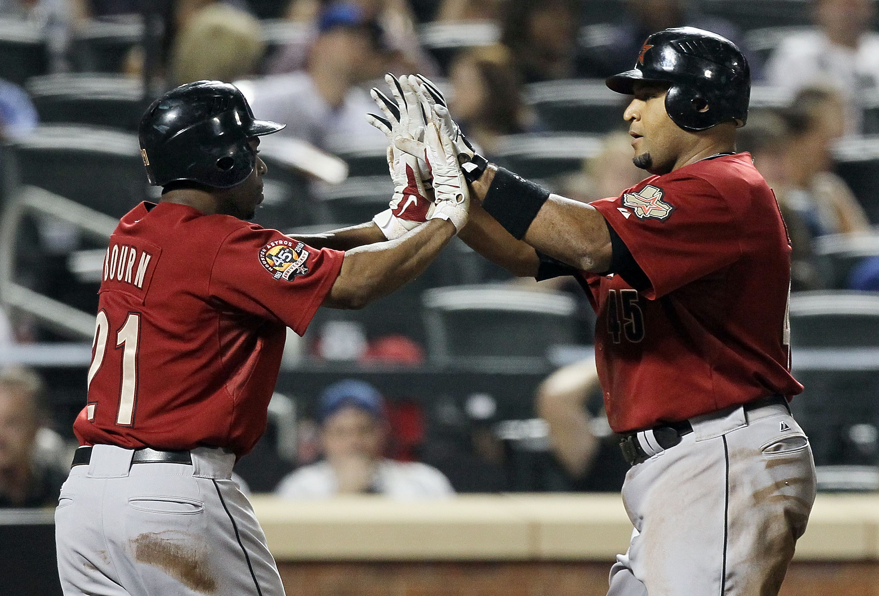 NEW YORK - AUGUST 28:  Carlos Lee #45 of the Houston Astros celebrates his fifth inning two run home run against the New York Mets with teammate Michael Bourn #21 on August 28, 2010 at Citi Field in the Flushing neighborhood of the Queens borough of New Y