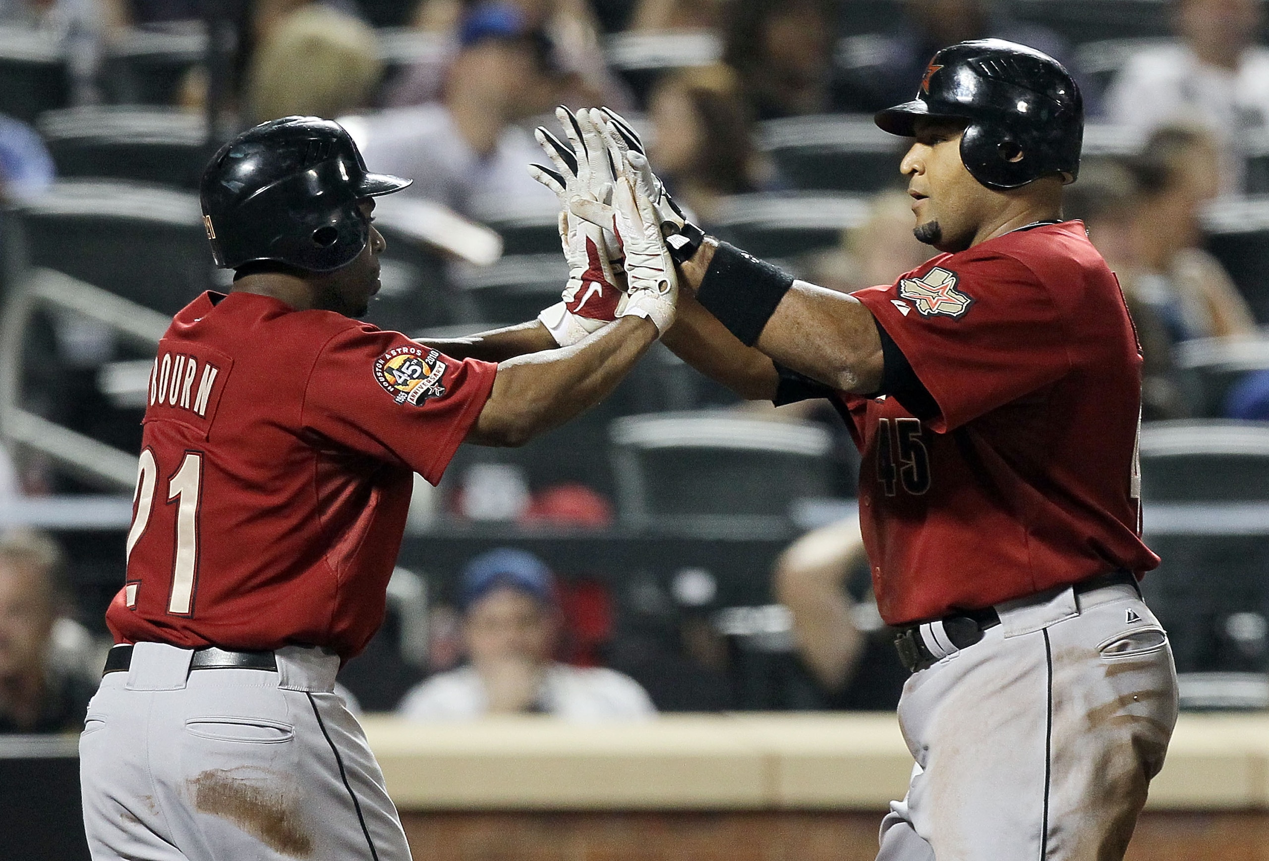 NEW YORK - AUGUST 28:  Carlos Lee #45 of the Houston Astros celebrates his fifth inning two run home run against the New York Mets with teammate Michael Bourn #21 on August 28, 2010 at Citi Field in the Flushing neighborhood of the Queens borough of New Y
