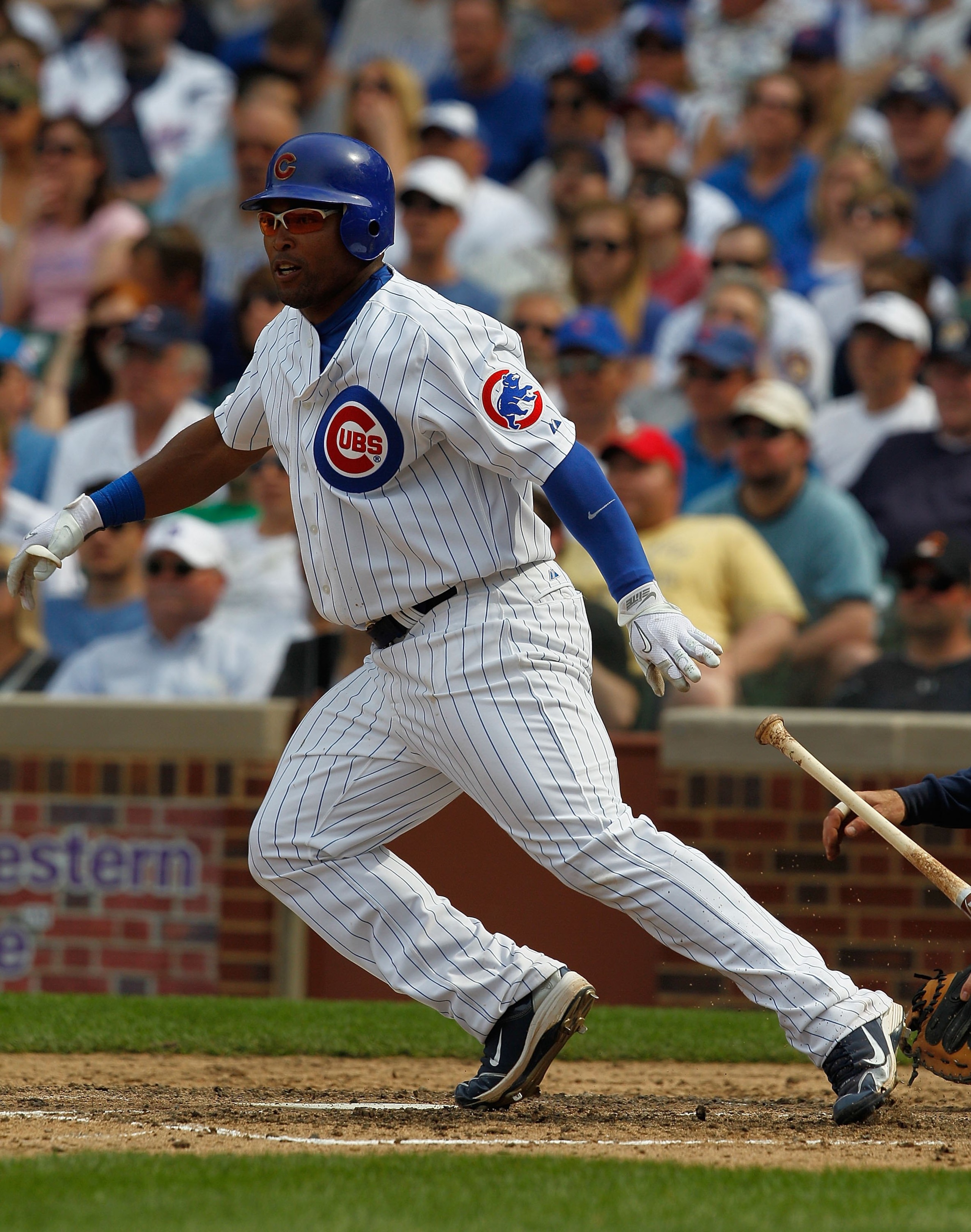 CHICAGO - APRIL 15: Marlon Byrd of the Chicago Cubs, wearing a number 42 jersey in honor of Jackie Robinson, hits the ball against the Milwaukee Brewers at Wrigley Field on April 15, 2010 in Chicago, Illinois. The Brewers defeated the Cubs 8-6. (Photo by