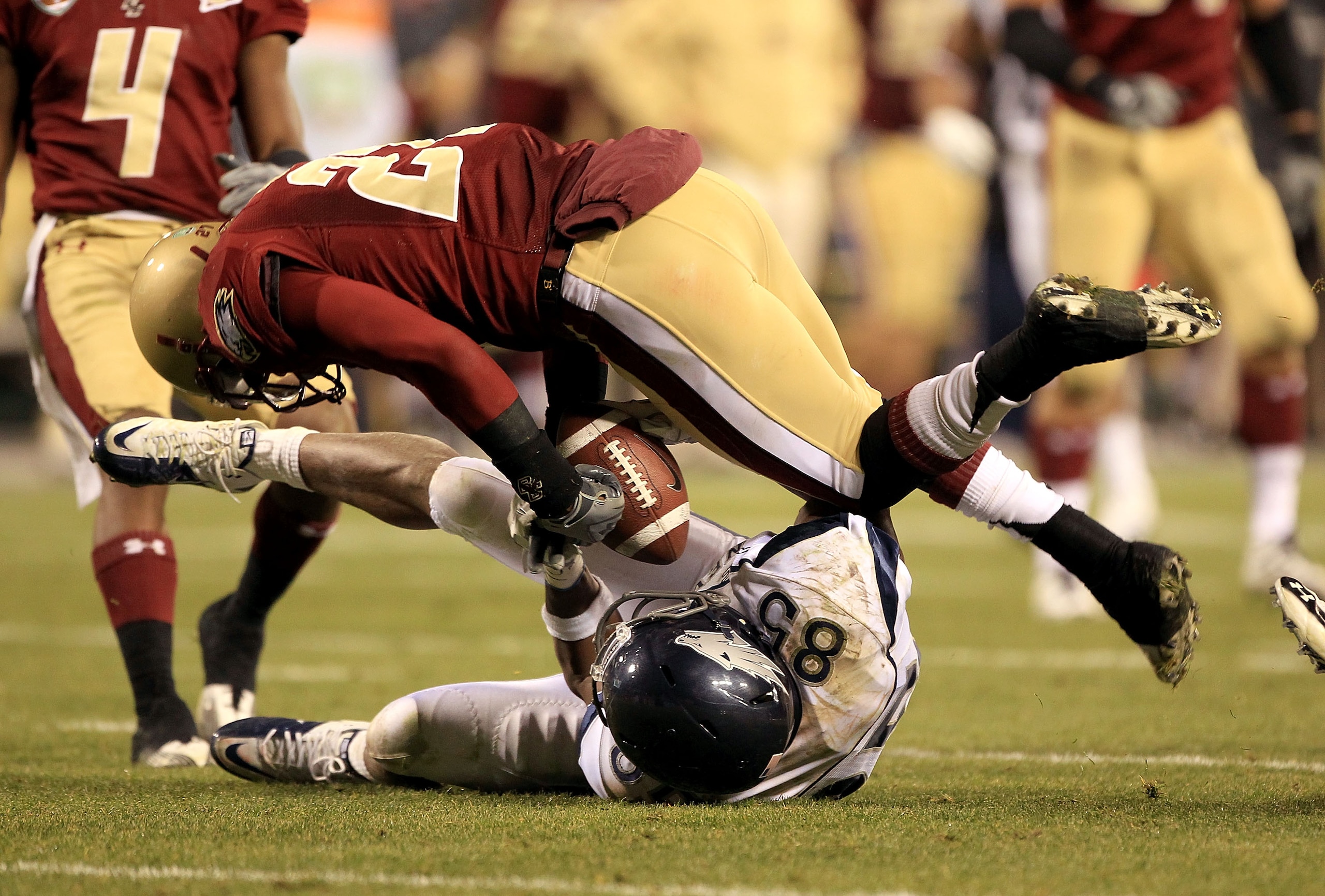 SAN FRANCISCO, CA - JANUARY 09: Virgil Green #85 of the Nevada Wolf Pack and Okechukwu Okoroha #27 of Boston College fight for the ball during the Kraft Fight Hunger Bowl at AT&T Park on January 9, 2011 in San Francisco, California. Green came down with SAN FRANCISCO, CA - JANUARY 09: Virgil Green #85 of the Nevada Wolf Pack and Okechukwu Okoroha #27 of Boston College fight for the ball during the Kraft Fight Hunger Bowl at AT&T Park on January 9, 2011 in San Francisco, California. Green came down with