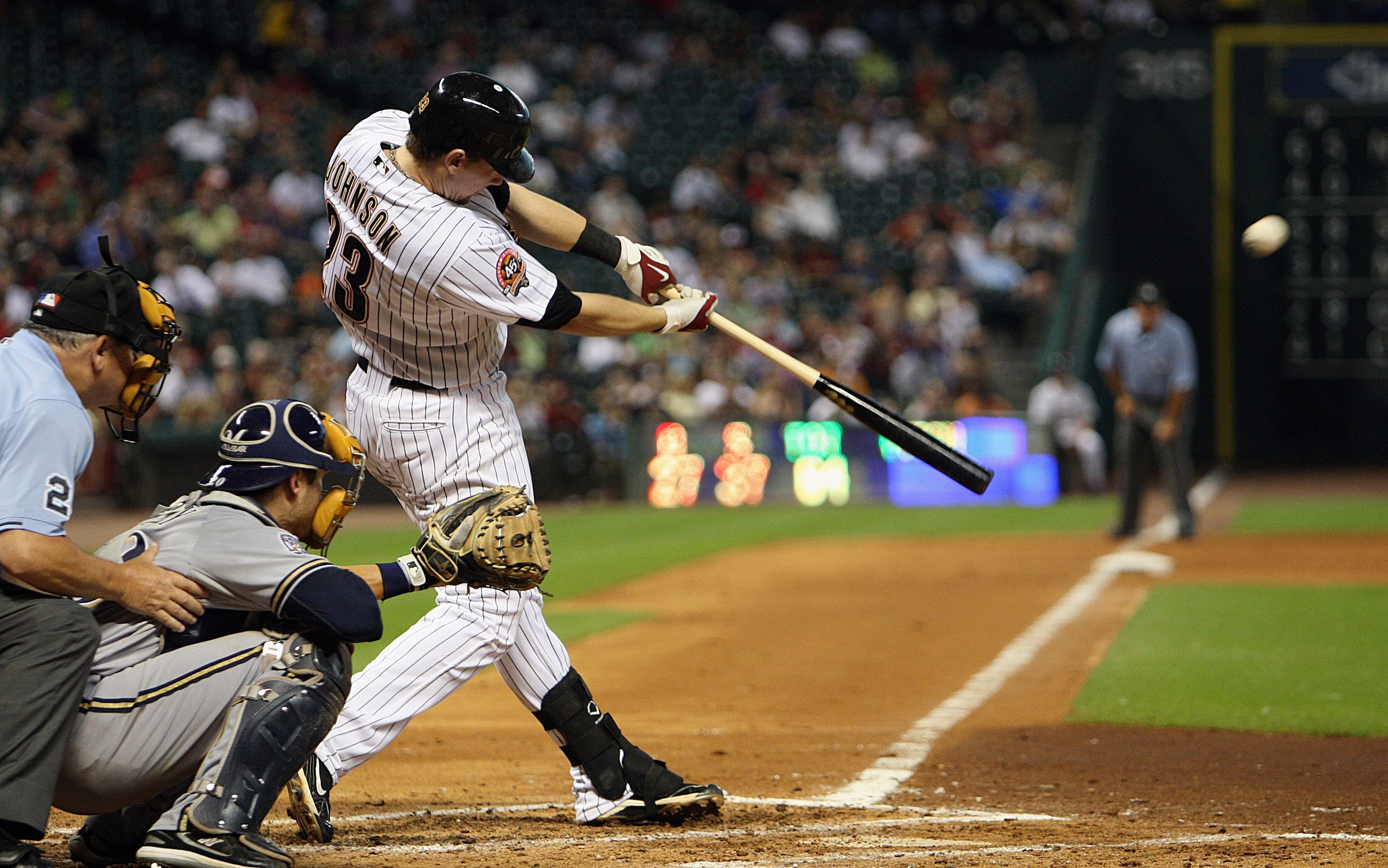 HOUSTON - JULY 30:  Chris Johnson #23 of the Houston Astros hits a three-run home run in the fourth inning against the Milwaukee Brewers at Minute Maid Park on July 30, 2010 in Houston, Texas. Houston won 5-0. (Photo by Bob Levey/Getty Images)