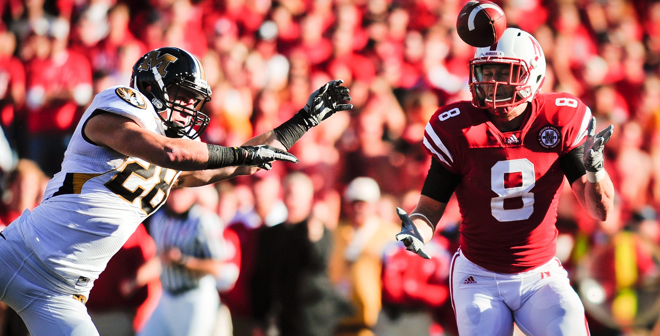 LINCOLN, NE - OCTOBER 30: Wide receiver T.J. Moe #28 of the Missouri Tigers tips a pass in front of safety Austin Cassidy #8 of the Nebraska Cornhuskers during second half action of their game at Memorial Stadium on October 30, 2010 in Lincoln, Nebraska.