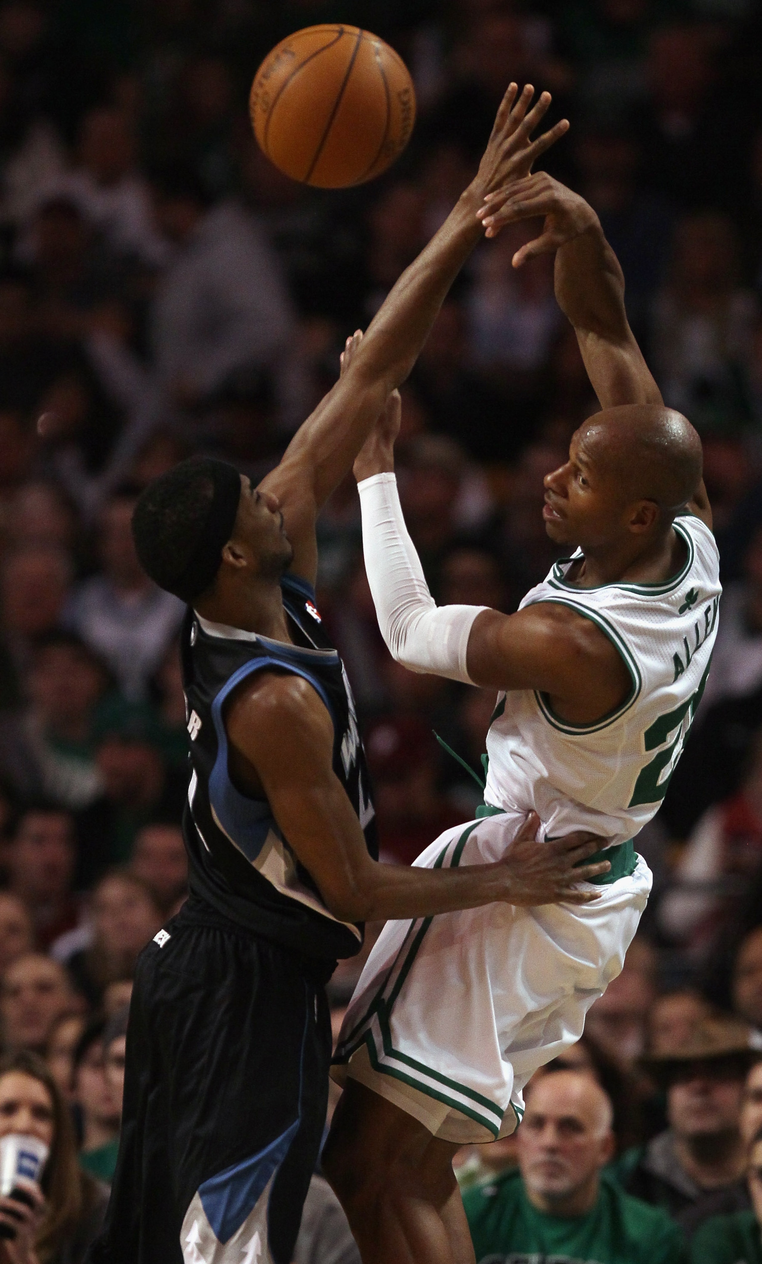 BOSTON, MA - JANUARY 03:  Ray Allen #20 of the Boston Celtics passes the ball around Corey Brewer #22 of the Minnesota Timberwolves on January 3, 2011 at the TD Garden in Boston, Massachusetts. NOTE TO USER: User expressly acknowledges and agrees that, by