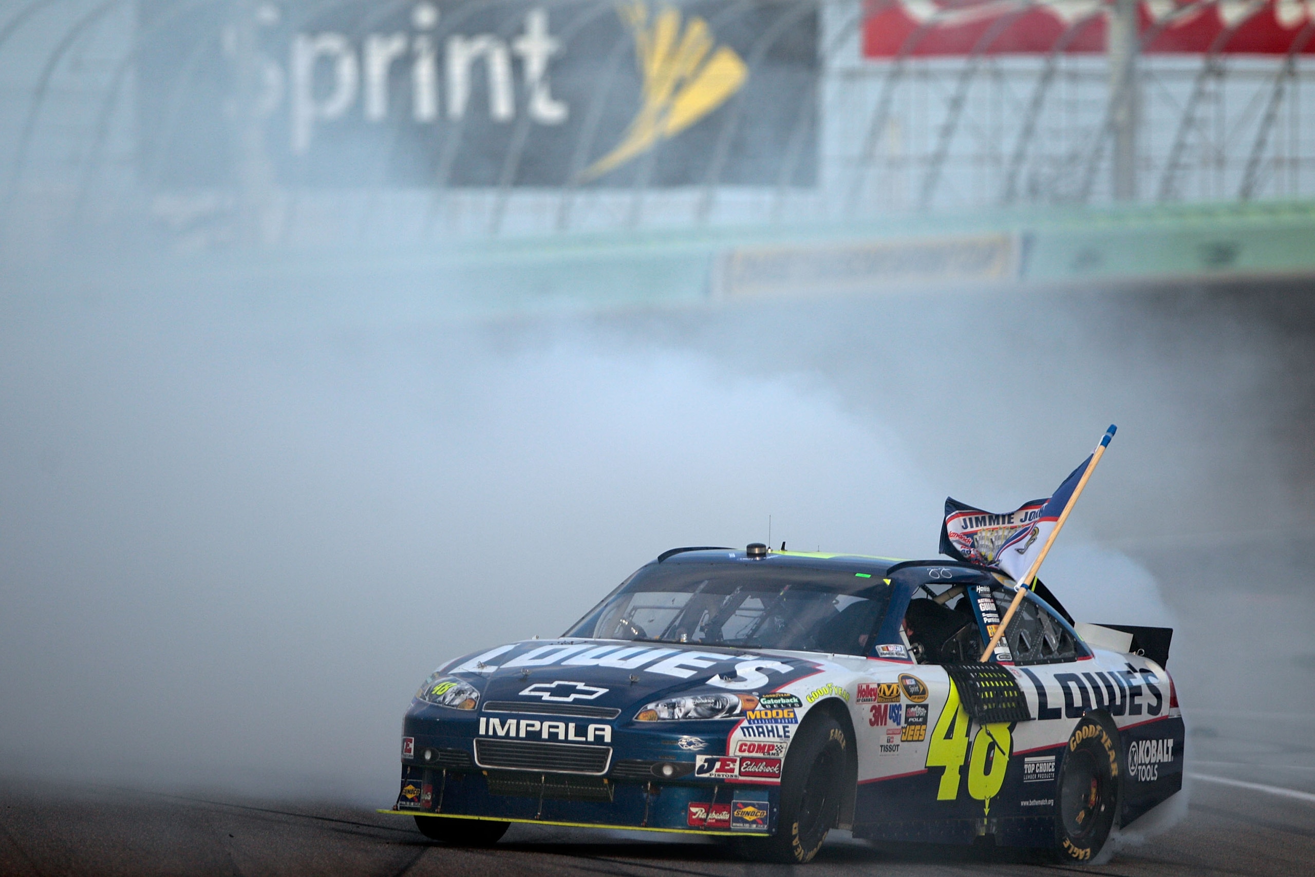 HOMESTEAD, FL - NOVEMBER 21: Jimmie Johnson, driver of the #48 Lowe's Chevrolet, celebrates with a burnout after finishing in second place in the Ford 400 to clinch a fifth consecutive NASCAR Sprint Cup championship at Homestead-Miami Speedway on Novembe HOMESTEAD, FL - NOVEMBER 21: Jimmie Johnson, driver of the #48 Lowe's Chevrolet, celebrates with a burnout after finishing in second place in the Ford 400 to clinch a fifth consecutive NASCAR Sprint Cup championship at Homestead-Miami Speedway on Novembe