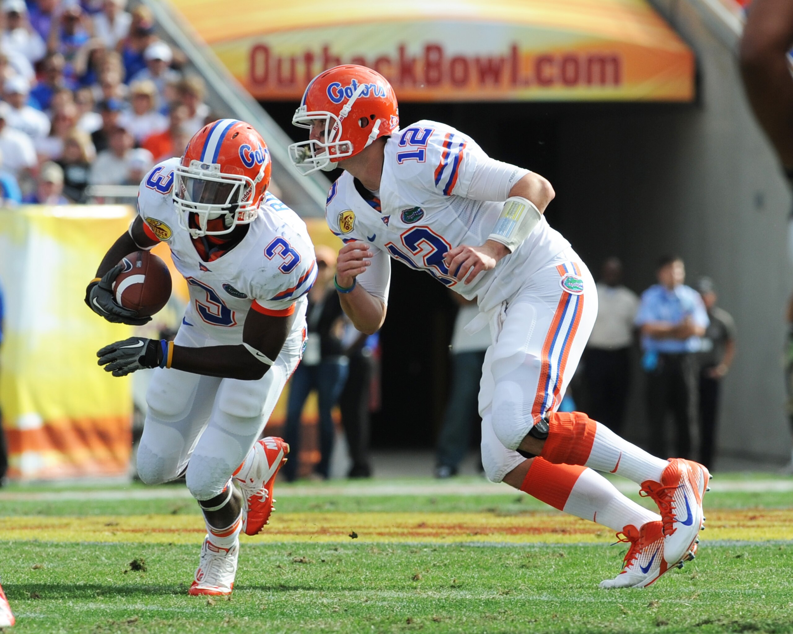 TAMPA, FL - JANUARY 1: Quarterback John Brantley #12 of the Florida Gators hands off to running back Chris Rainey #3 against the Penn State Nittany Lions January 1, 2011 in the 25th Outback Bowl at Raymond James Stadium in Tampa, Florida. (Photo by Al M TAMPA, FL - JANUARY 1: Quarterback John Brantley #12 of the Florida Gators hands off to running back Chris Rainey #3 against the Penn State Nittany Lions January 1, 2011 in the 25th Outback Bowl at Raymond James Stadium in Tampa, Florida. (Photo by Al M