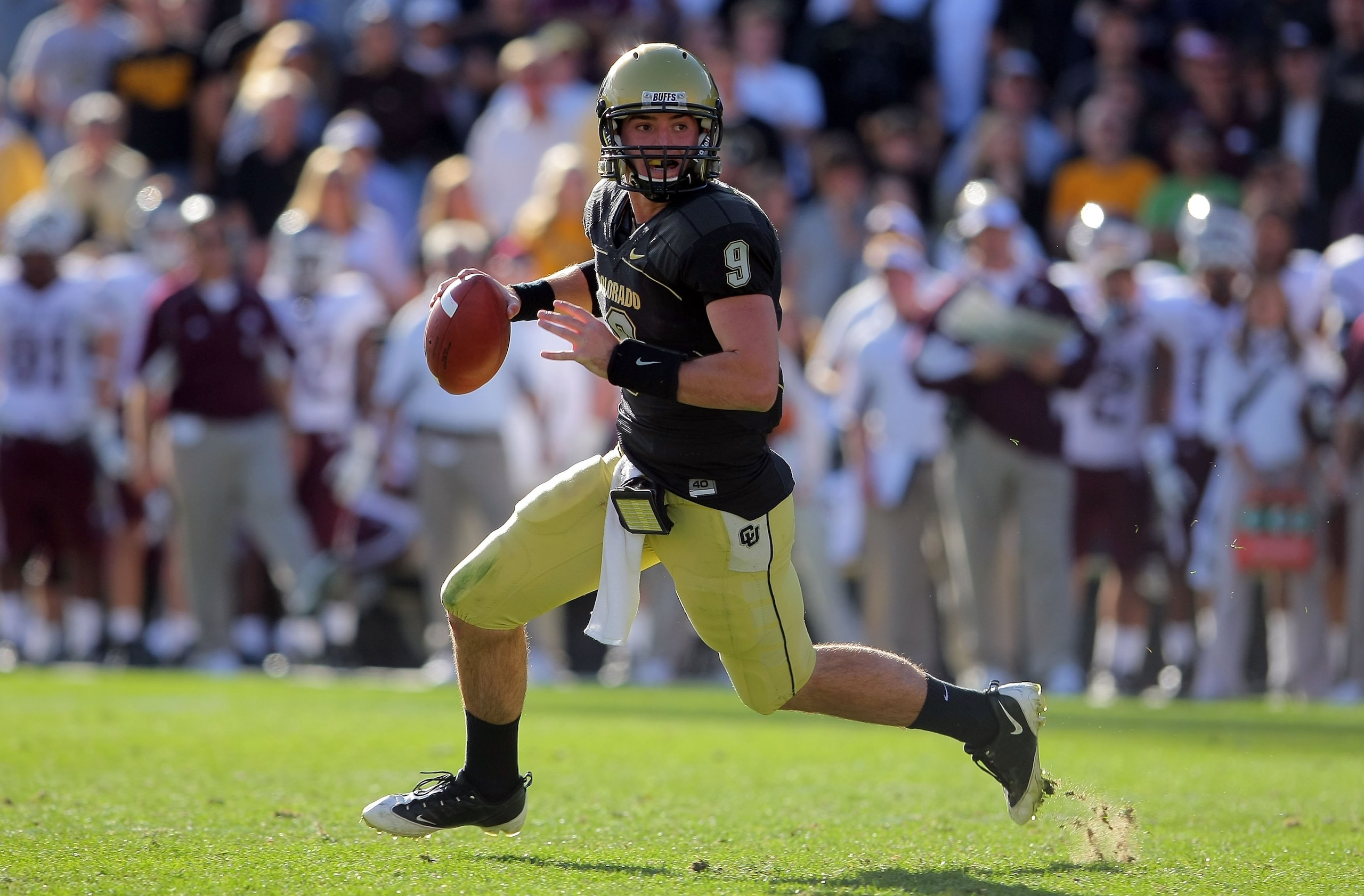 BOULDER, CO - NOVEMBER 07: Quarterback Tyler Hansen #9 of the Colorado Buffaloes rolls out to deliver a pass against the Texas A&M Aggies during NCAA college football action at Folsom Field on November 7, 2009 in Boulder, Colorado. Colorado defeated Texa BOULDER, CO - NOVEMBER 07: Quarterback Tyler Hansen #9 of the Colorado Buffaloes rolls out to deliver a pass against the Texas A&M Aggies during NCAA college football action at Folsom Field on November 7, 2009 in Boulder, Colorado. Colorado defeated Texa