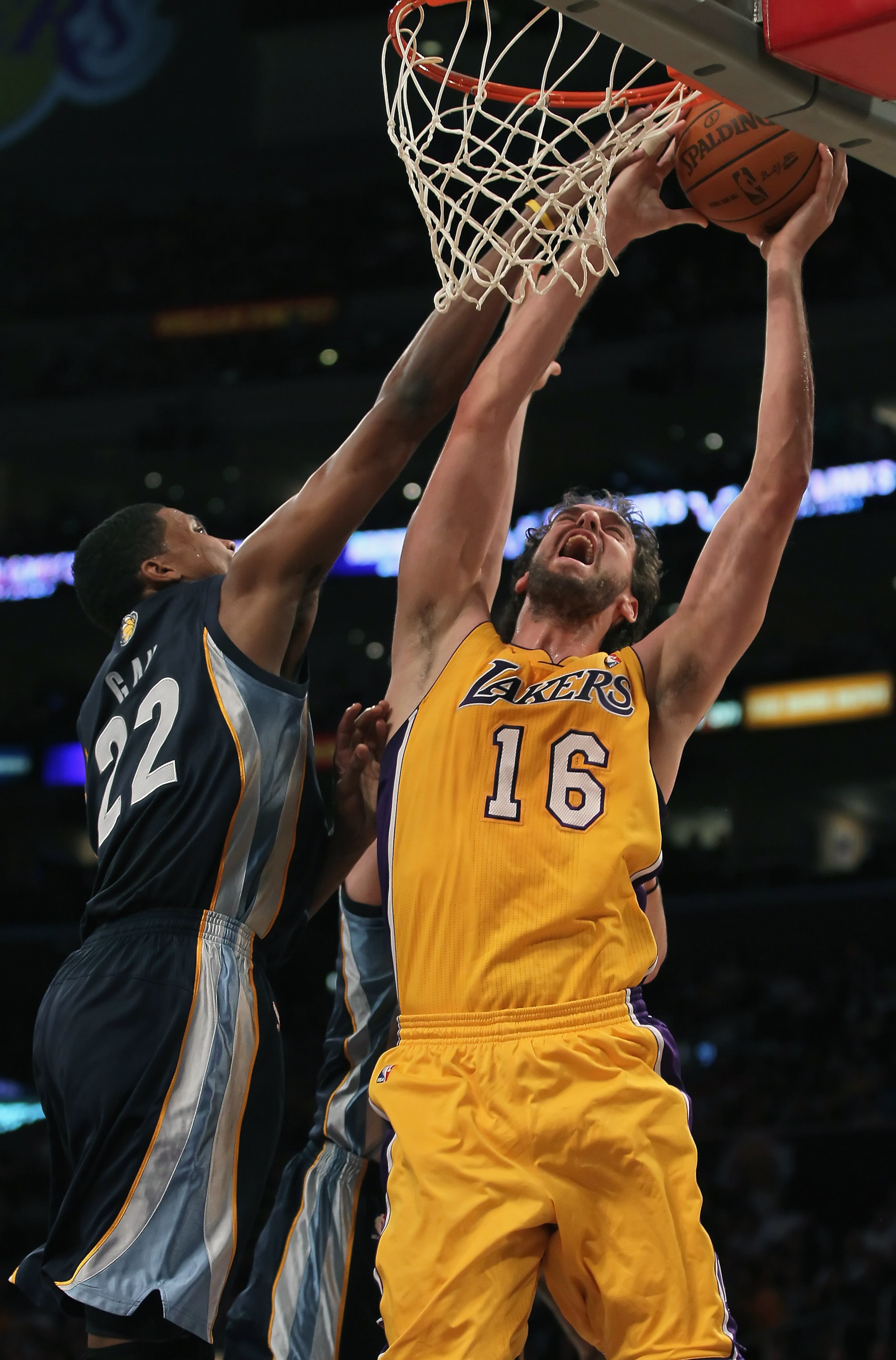 LOS ANGELES, CA - NOVEMBER 02:  Pau Gasol #16 of the Los Angeles Lakers drives to the basket while being defended by Rudy Gay #22 of the Memphis Grizzlies during the first quarter at Staples Center on November 2, 2010 in Los Angeles, California. NOTE TO U